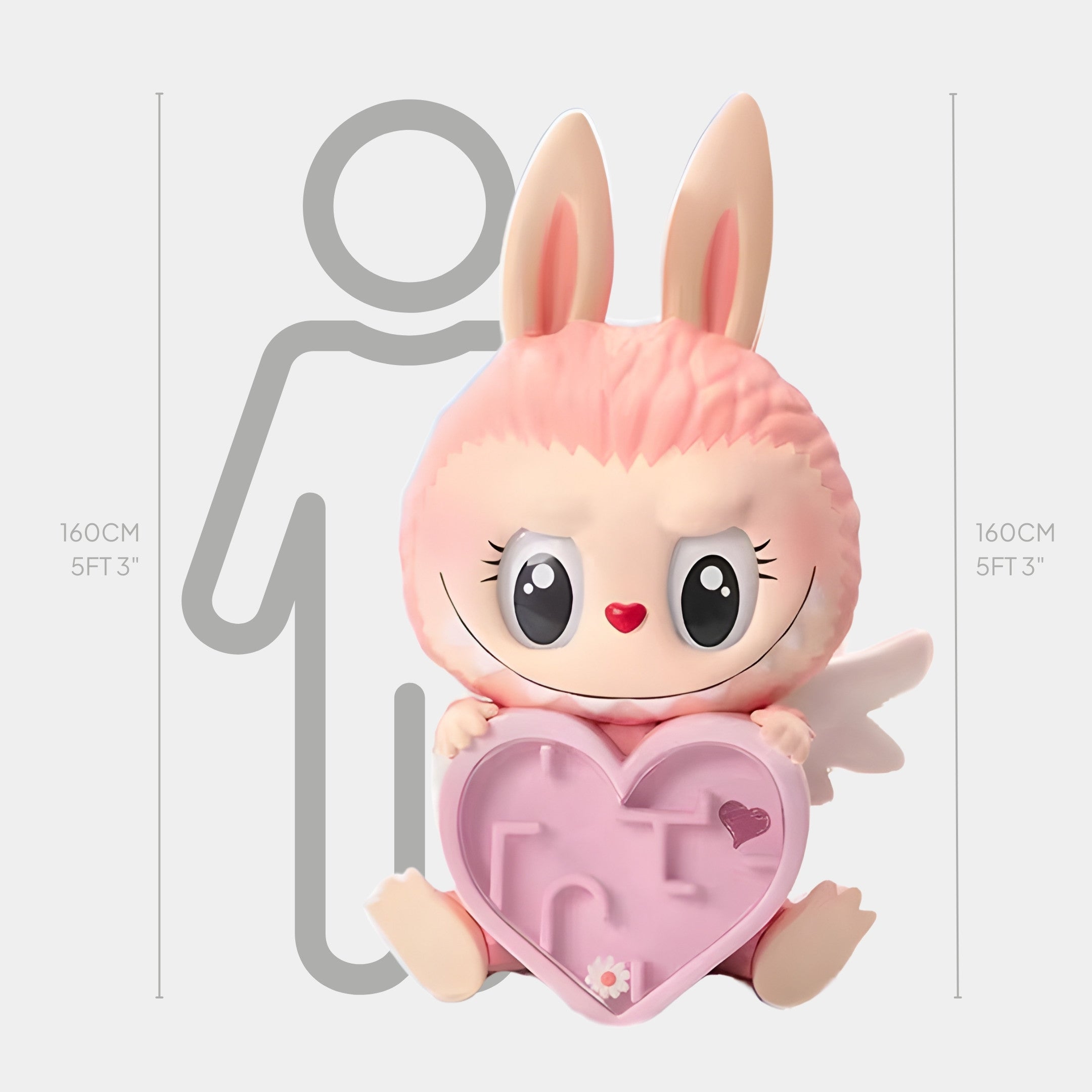 The Mokoko Heart Maze Labubu Sculpture by Giant Sculptures stands 160cm tall, featuring a large pink bunny-like figure with big eyes, wings, and a heart-shaped object, shown beside a height chart and human outline for scale.