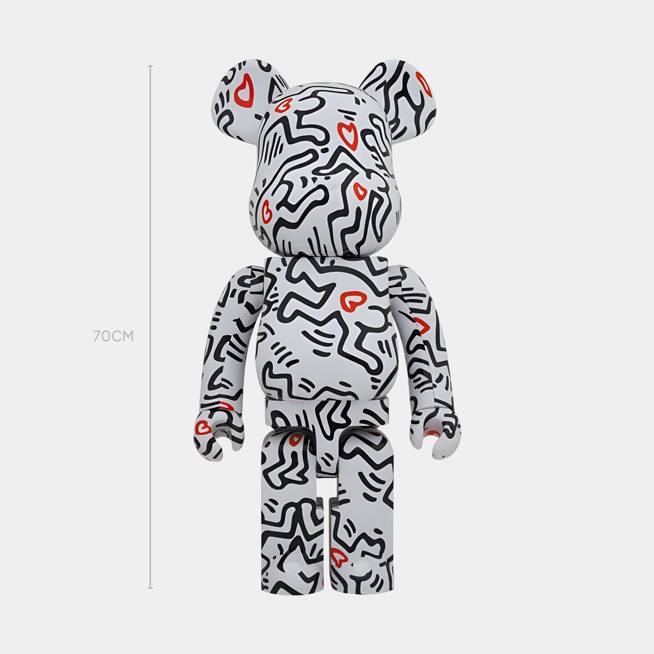 The Giant Sculptures Heartbeat Groove Bear Sculpture - 70cm stands upright against a plain backdrop, its white surface decorated with black wavy lines and red hearts, echoing pop-art murals in this limited release.
