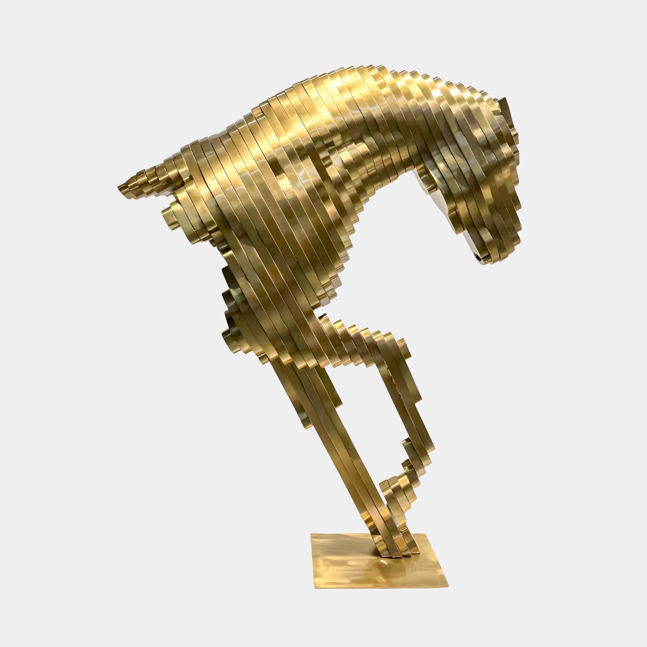 The Horse Gold Steel Abstract Sculpture (75/250cm) by Giant Sculptures features a modern, geometric horse in gold stainless steel, crafted from stacked horizontal plates and rearing on its hind legs against a plain backdrop.