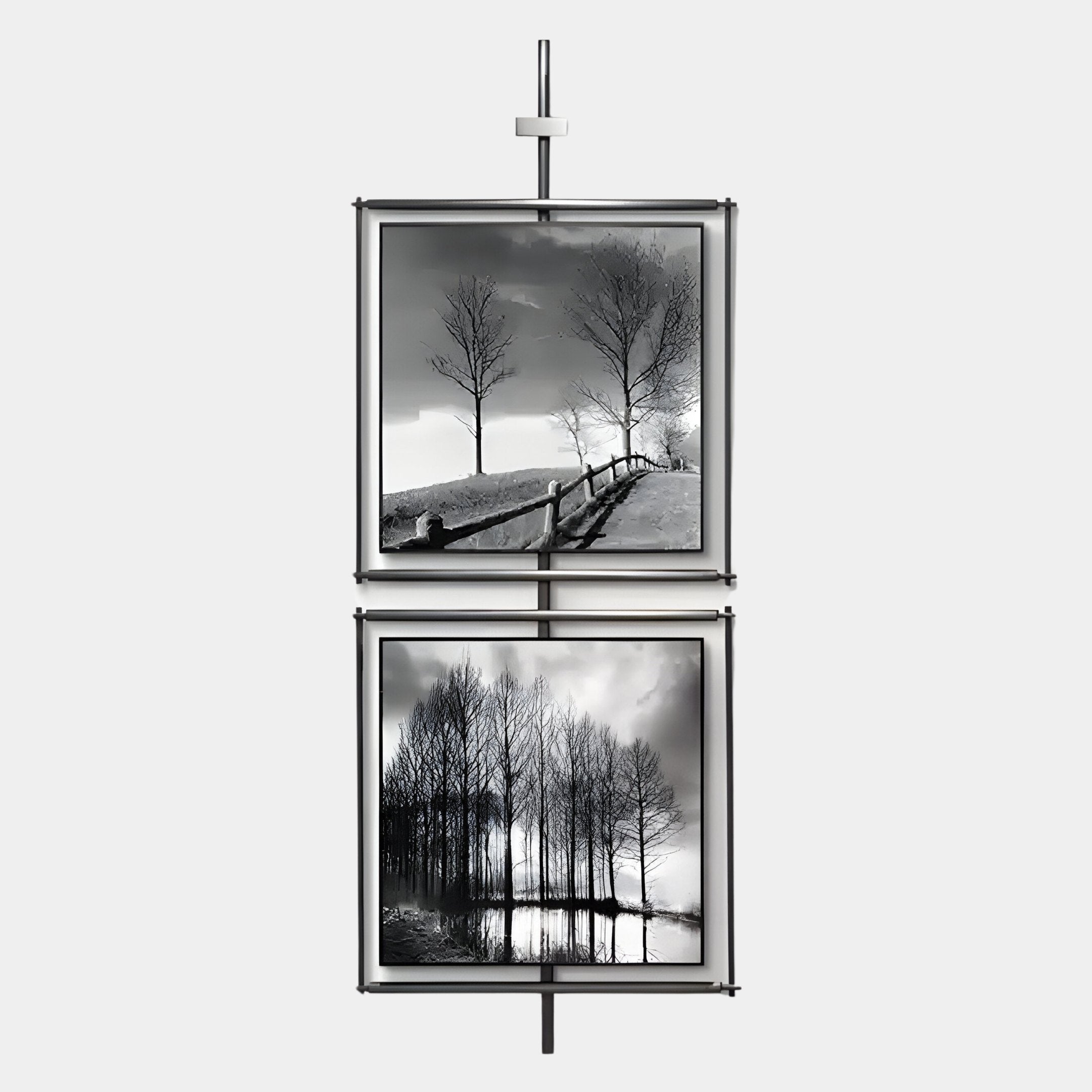 The Vistarte Landscapes Abstract Dual Panel Metal Wall Art by Giant Sculptures features striking black-and-white scenes of fences, bare trees, and water, displayed vertically on a minimalist metal rod for a modern look.