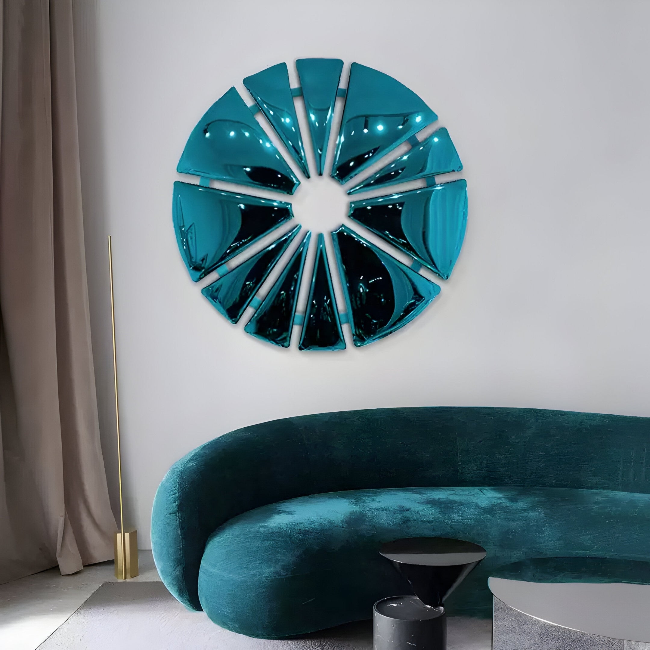 A modern living room highlights a teal semi-circular couch, a geometric radial-segmented mirror in aqua, and Giant Sculptures Halo Aqua Segment Circle 3D Metal Wall Art. A slender floor lamp complements taupe curtains, while a black side table adds a contemporary touch.