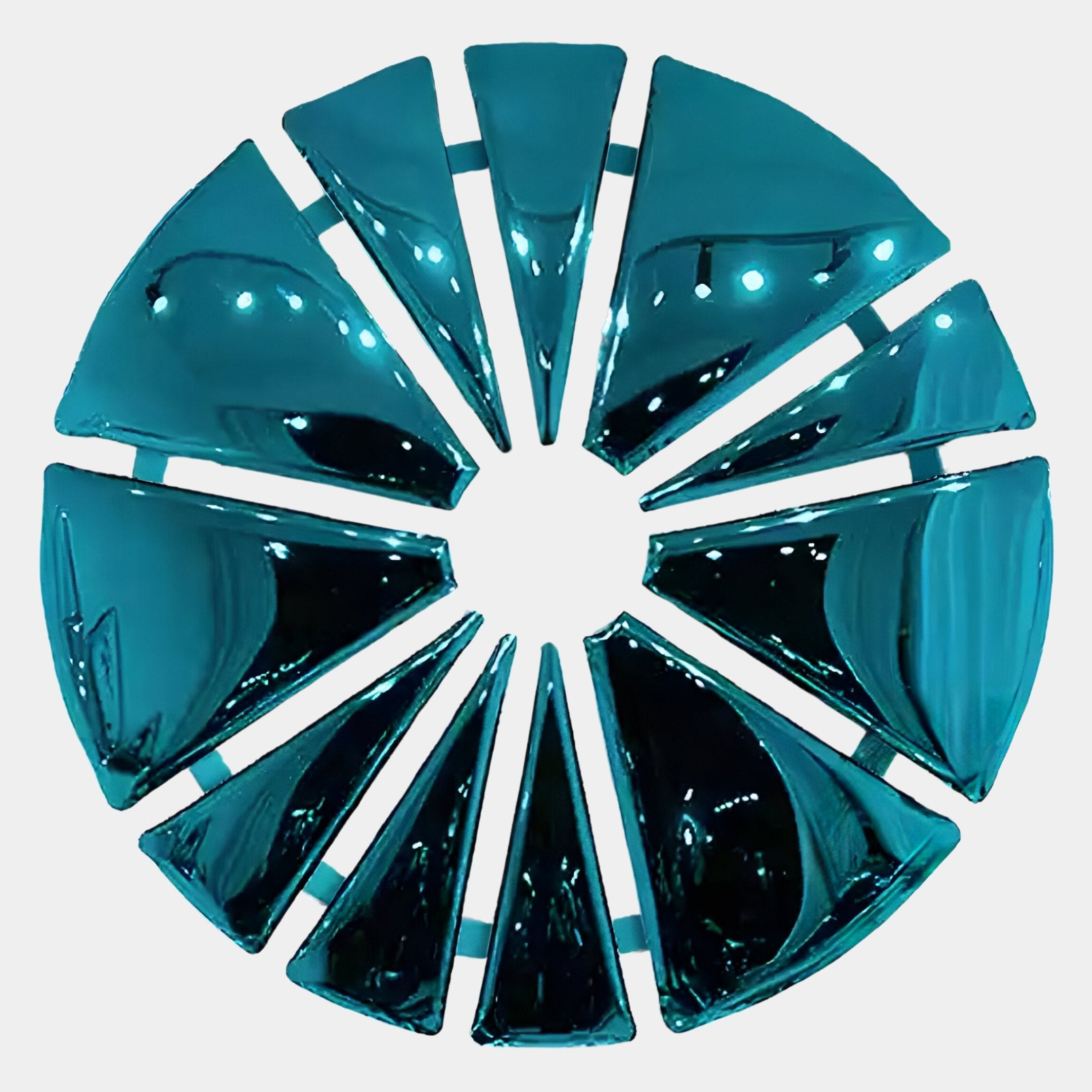 The Halo Aqua Segment Circle 3D Metal Wall Art by Giant Sculptures features reflective turquoise glass wedges arranged in a circle with open spaces, creating an abstract modern accent for any room.