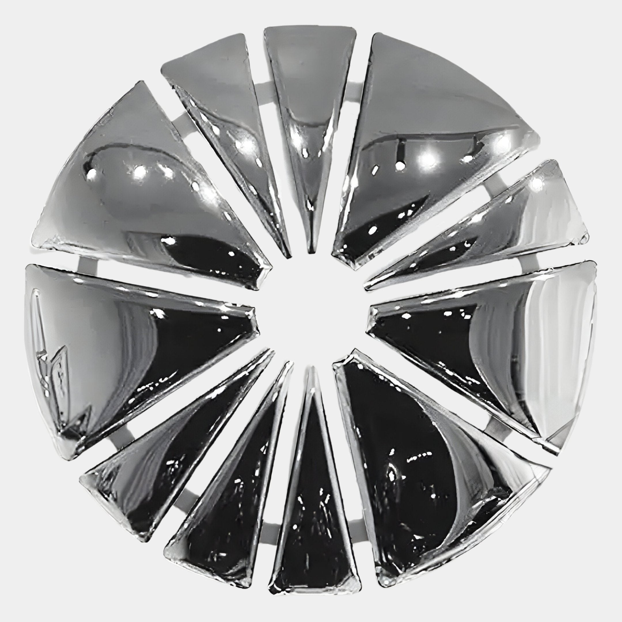 The Halo Chrome Segment Circle 3D Metal Wall Art by Giant Sculptures features shiny chrome circles in a geometric design with an open center, adding a striking modern accent to contemporary interiors.