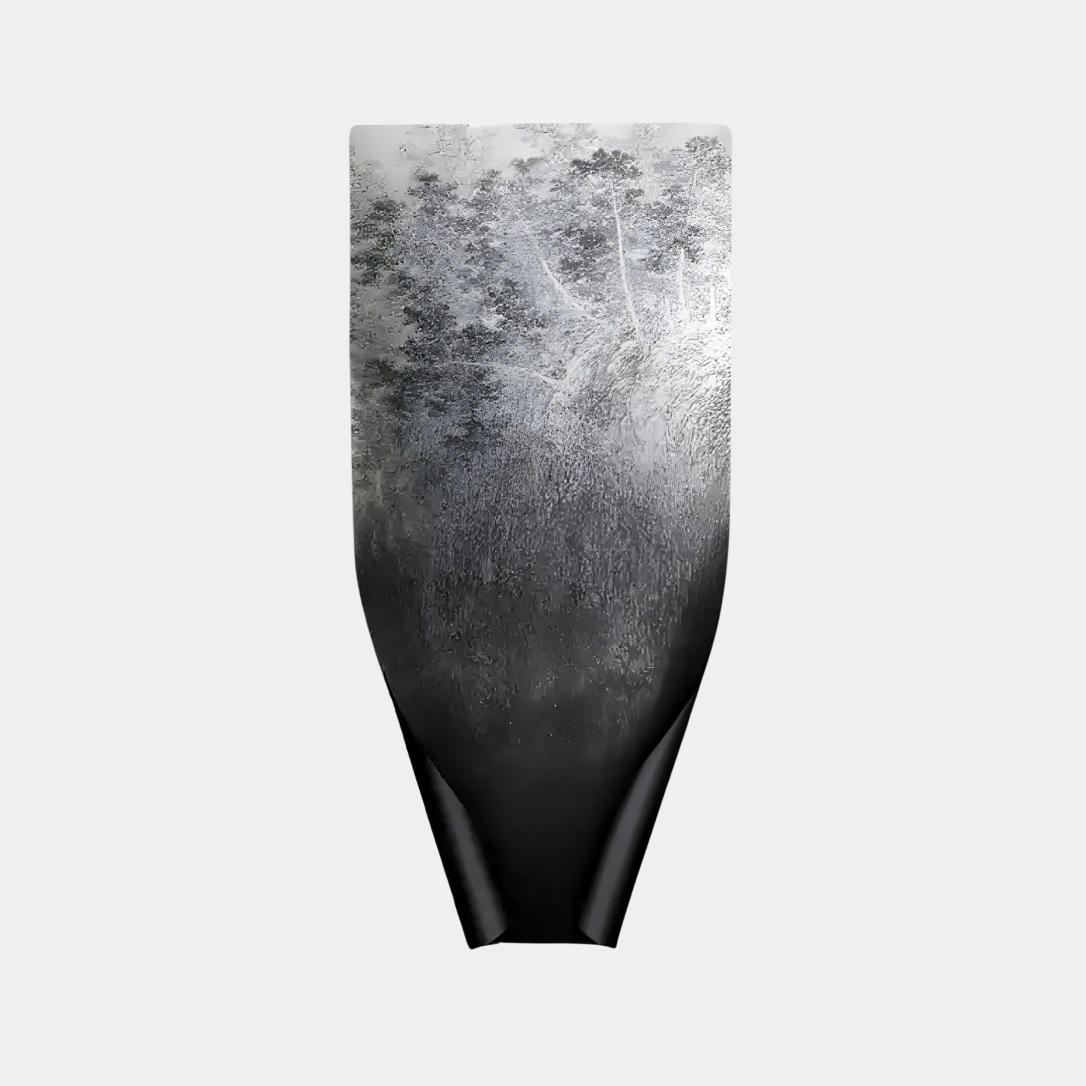 A tall black vase with a textured, reflective finish mirrors Giant Sculptures’ Echo Forest Wall Art, showcasing an abstract pattern akin to mist rising through a forest. The design fades from dark at the base to lighter hues at the top against a plain light gray background.