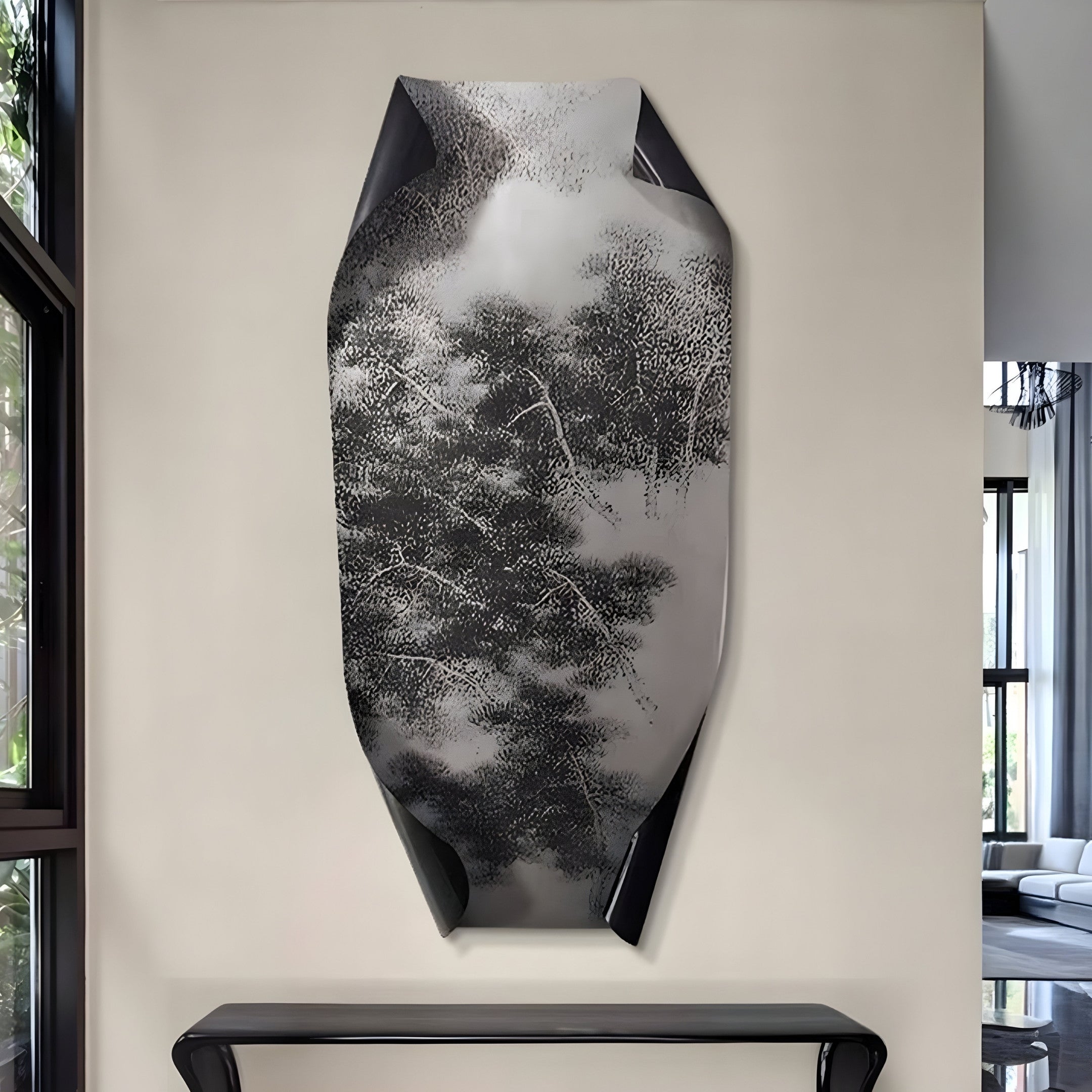 The Echo Nature-Inspired Abstract Panel Metal Etched 3D Wall Art by Giant Sculptures, featuring an intricate tree design, hangs above a sleek black console table against a light wall. Large windows on the left flood the space with natural light, enhancing its modern aesthetic.