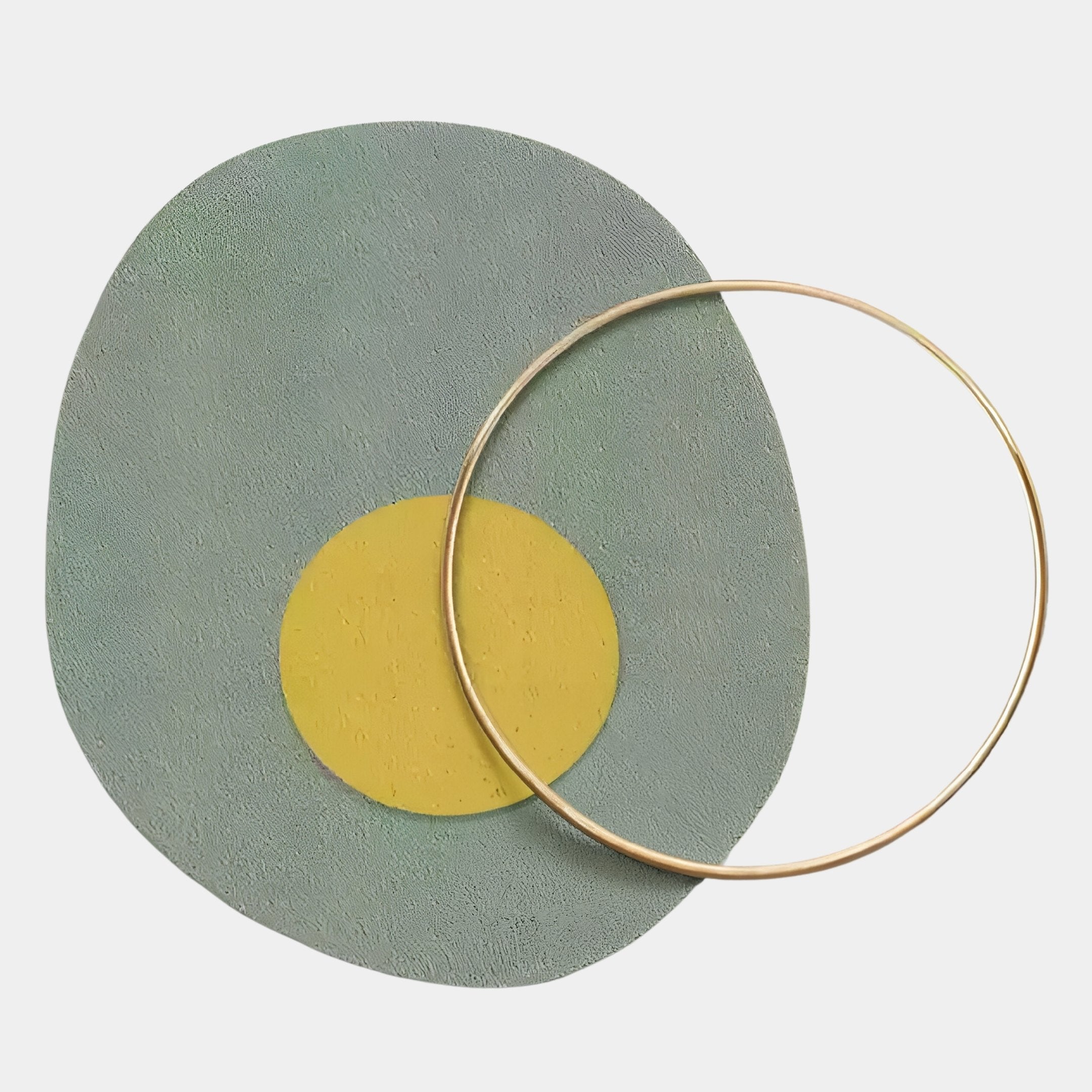 The Solaro Calming Green & Yellow Round Mural Wall Art by Giant Sculptures features a textured green-grey oval with a yellow center and thin gold ring on a white background—perfect for minimalist decor lovers.