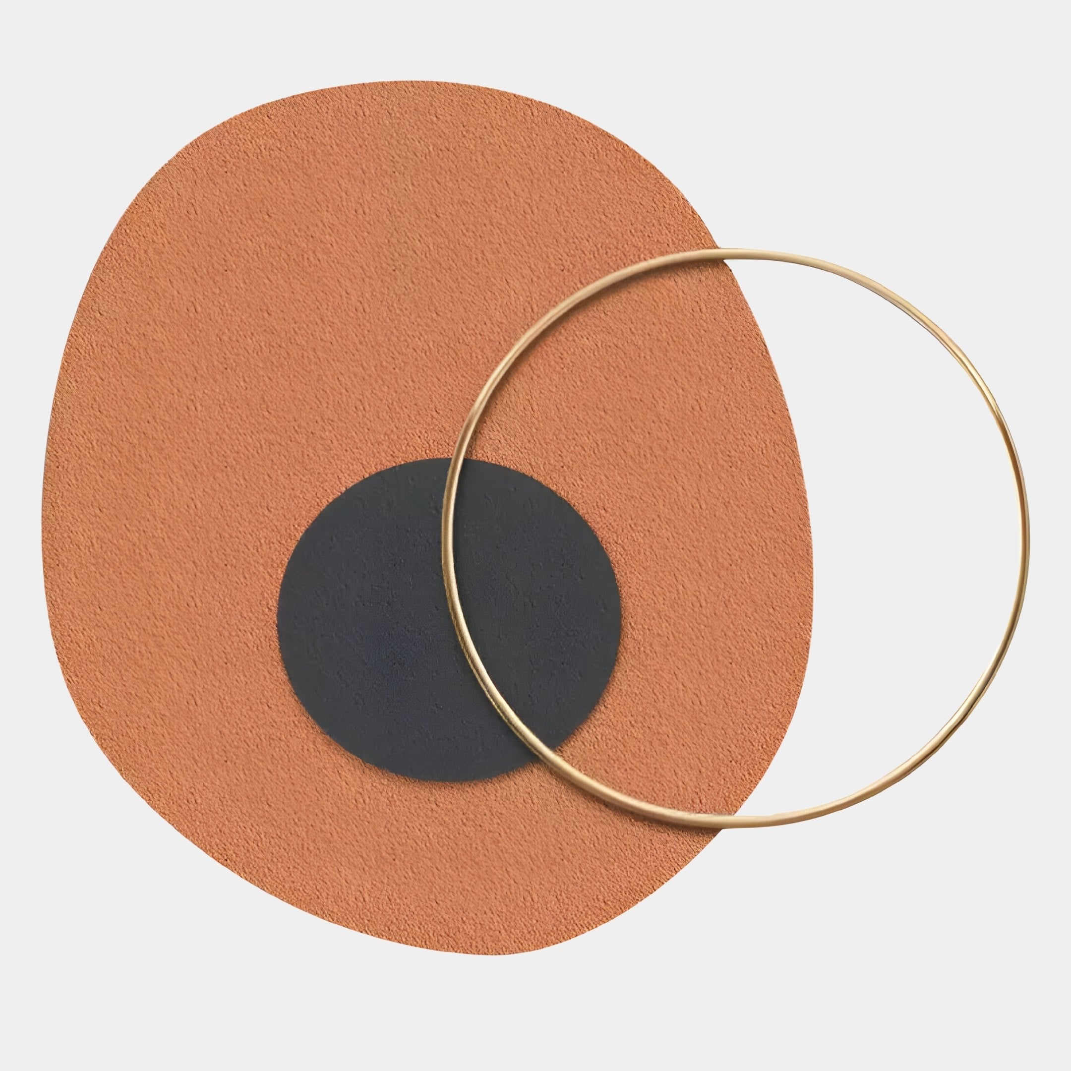 The Solaro Earthy Terracotta & Black Round Mural Wall Art by Giant Sculptures features a textured orange oval, solid black circle, and thin gold ring on white—perfect as modern terracotta wall decor.
