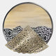 The Aurelio Bottom Metallic Layered Textured Round Wall Art by Giant Sculptures features a hand-painted abstract landscape with a pale sky, black and white mountains, and a perforated gold triangle in the foreground for added depth.