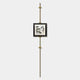 The Ecliptica Fragmented Geometric Gold Frame Wall Art by Giant Sculptures features minimalist black-and-white artwork centered on a tall brass rod with geometric details, displayed against a plain white background.