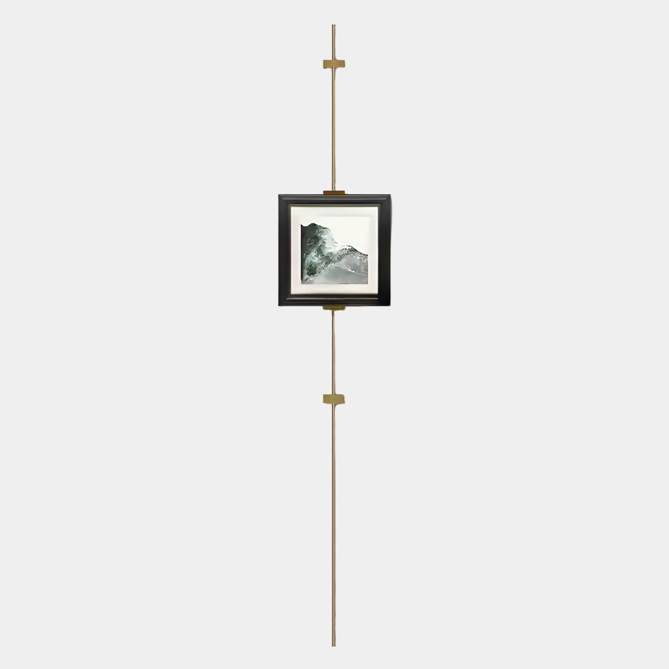 The Ecliptica Mountain Landscape Gold Frame Wall Art by Giant Sculptures hangs from a brass vertical picture rail system against a plain, light background.