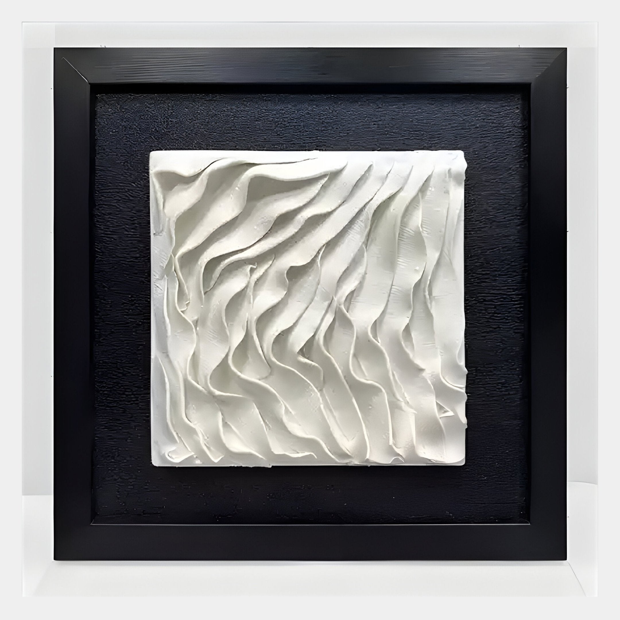 The Harmonia 3D Wave Ceramic Wall Sculpture by Giant Sculptures features a wave-textured white relief on a black background, elegantly framed in black with an acrylic box for modern style.