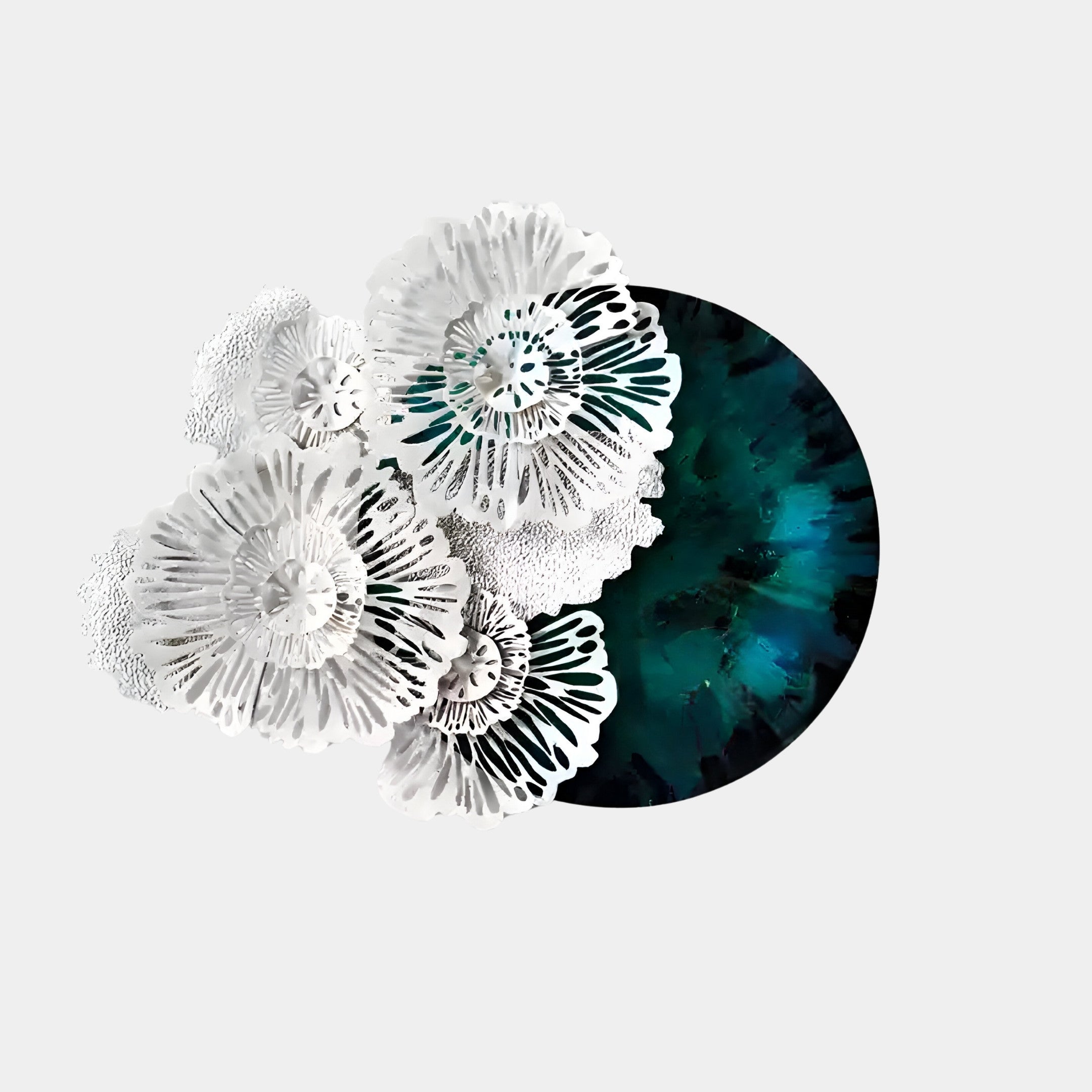 The Aurum Flora White Petals Emerald Metal Wall Art by Giant Sculptures showcases abstract white flowers with intricate patterns against a dark turquoise circle on light gray, adding delicate texture and contrast for an exquisite wall piece.