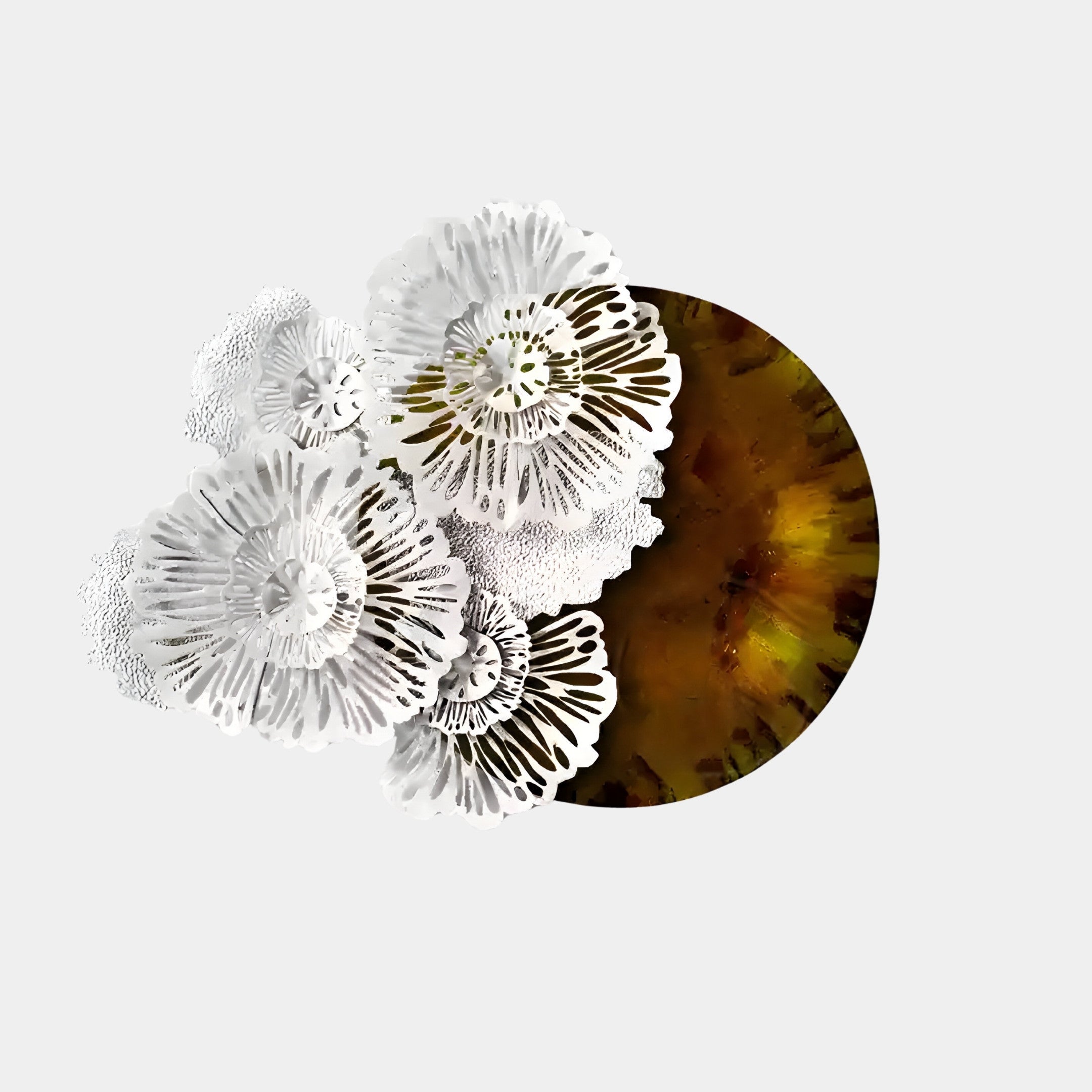 The Aurum Flora White Petals Amber Metal Wall Art by Giant Sculptures features intricate white floral-like circular patterns on the left, layered over a large brown and green circle on a light background—a perfect fit for contemporary interiors.