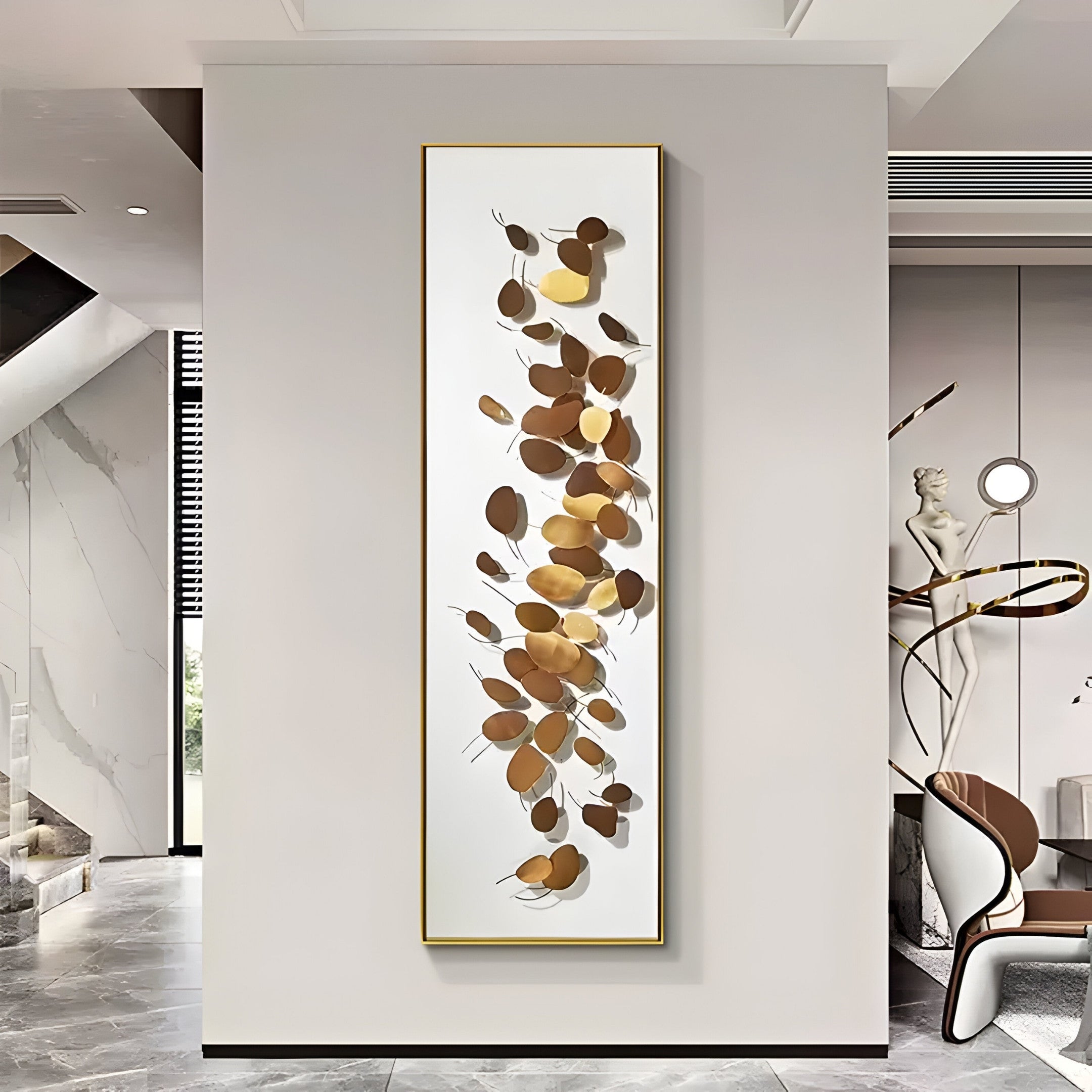 A modern interior features the Brassica Gold Leaf Metal Rectangular Wall Art by Giant Sculptures, showcasing gold and bronze designs on a light background. This piece is a focal point in a sleek room with marble floors, a sculpture, and contemporary lighting.