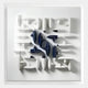 The Elysian 3D Ceramic Wall Art by Giant Sculptures features a square design with white, raised geometric shapes and sharp edges. Glossy navy blue forms in the center contrast with the matte background for a modern, sculptural look.