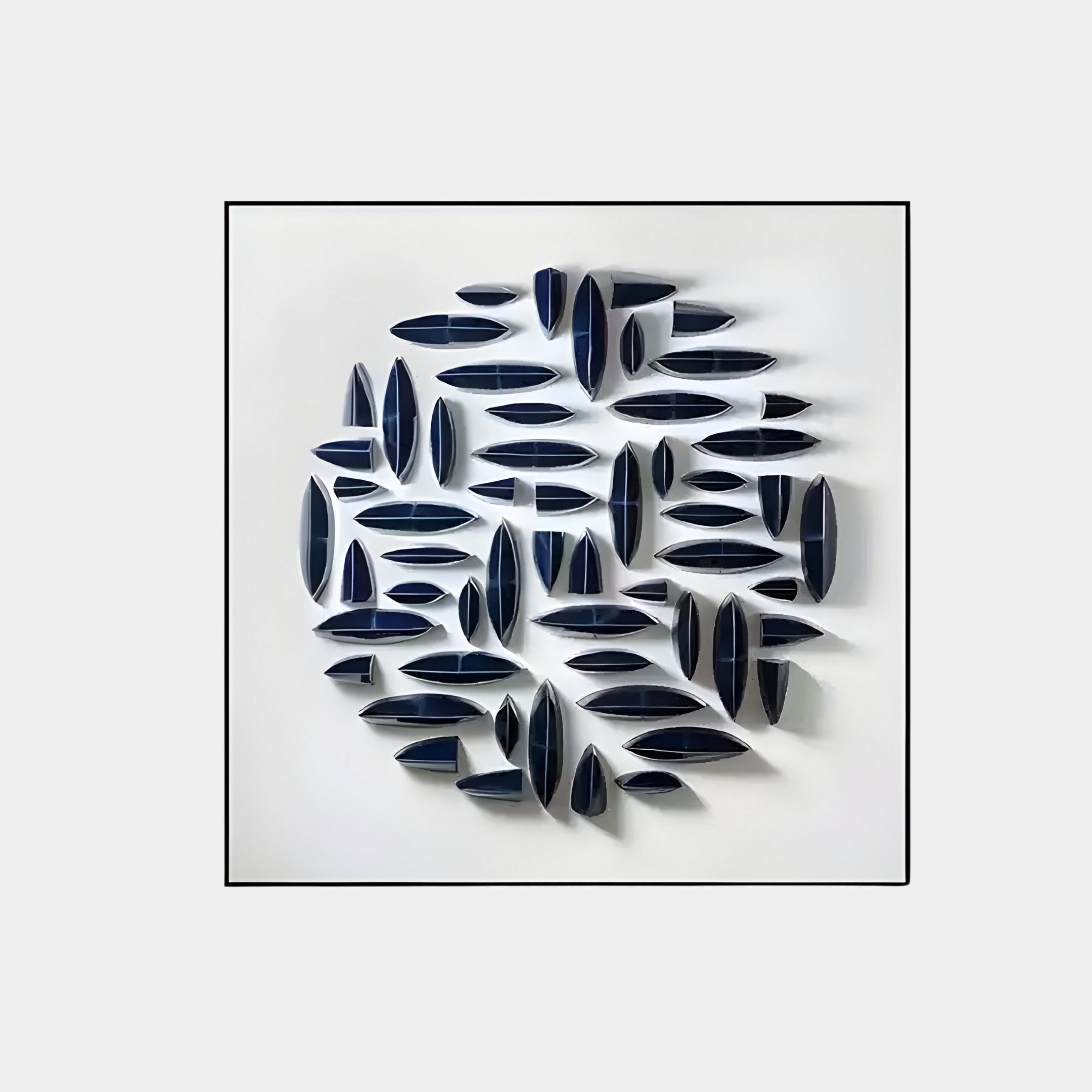 The Elysian 3D Ceramic Wall Art by Giant Sculptures boasts a circular organic design with navy blue and white shapes on a light grey background, creating leaf-like folds and shadows that evoke a modern wall sculpture, ideal for contemporary interiors.