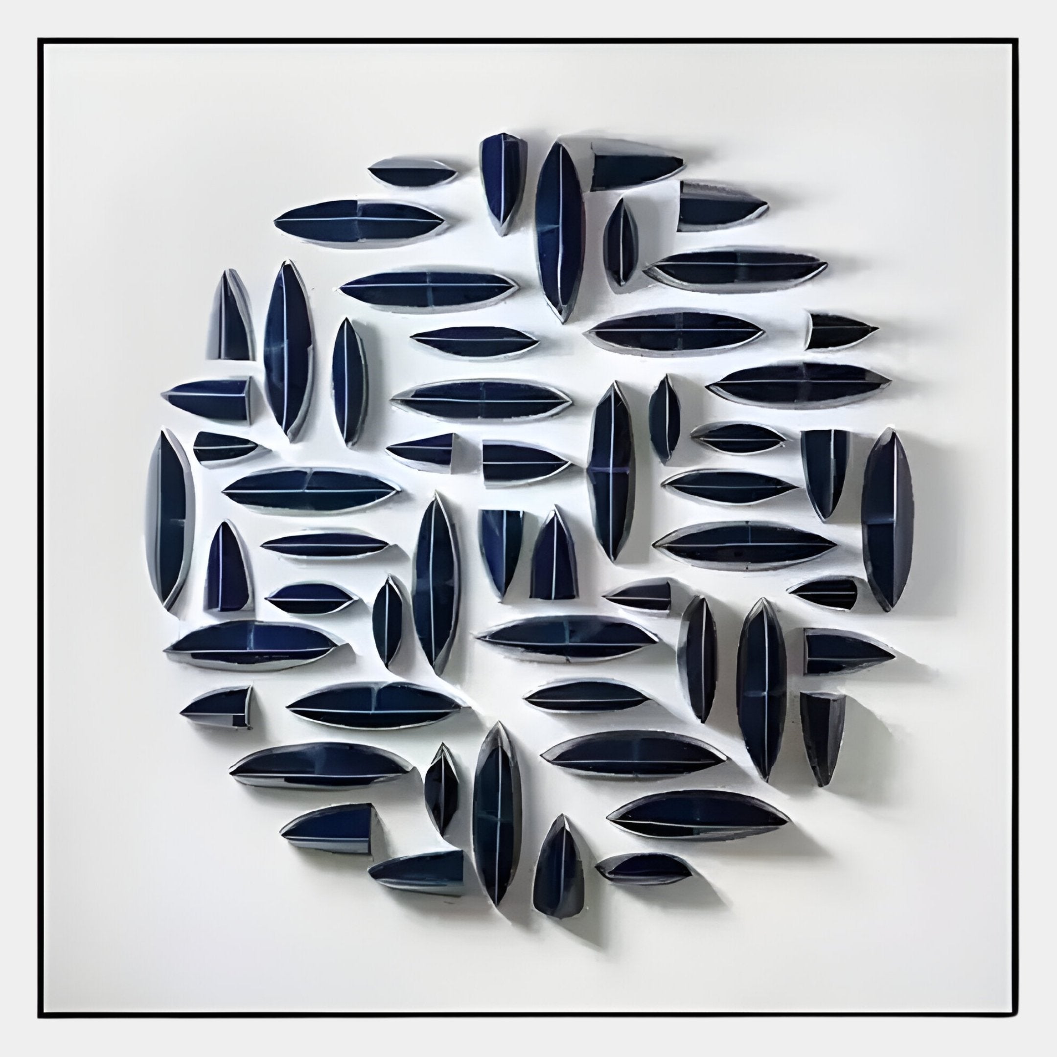 The Elysian 3D Ceramic Wall Art by Giant Sculptures features a circular arrangement of elongated, organic navy blue elements, creating subtle shadows—an ideal statement piece for contemporary interiors.