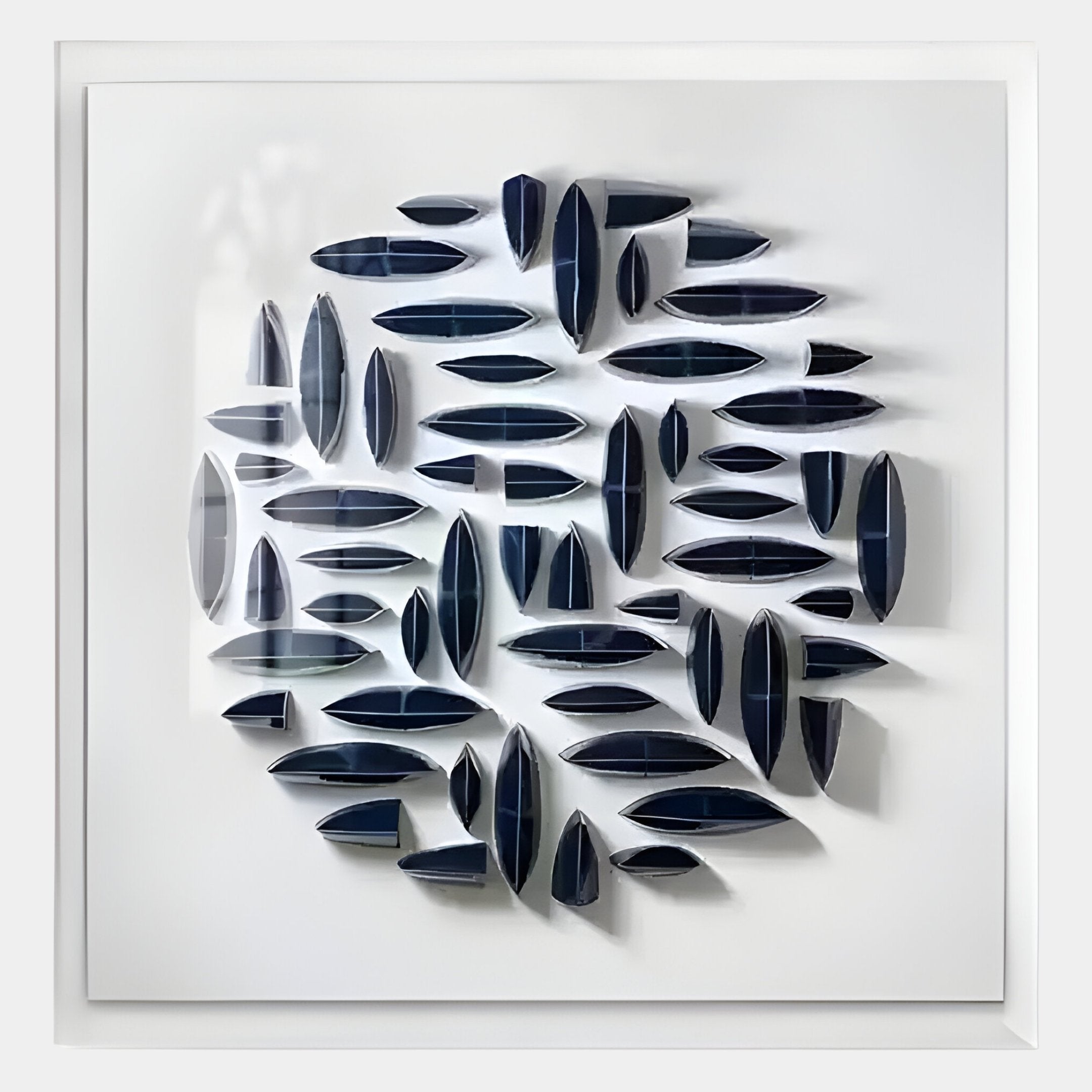 The Elysian 3D Ceramic Wall Art by Giant Sculptures features organic navy blue forms in a circular pattern, offering striking sculptural depth and shadow—perfect modern decor for enhancing any contemporary interior.