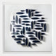The Elysian 3D Ceramic Wall Art by Giant Sculptures features organic navy blue forms in a circular pattern, offering striking sculptural depth and shadow—perfect modern decor for enhancing any contemporary interior.