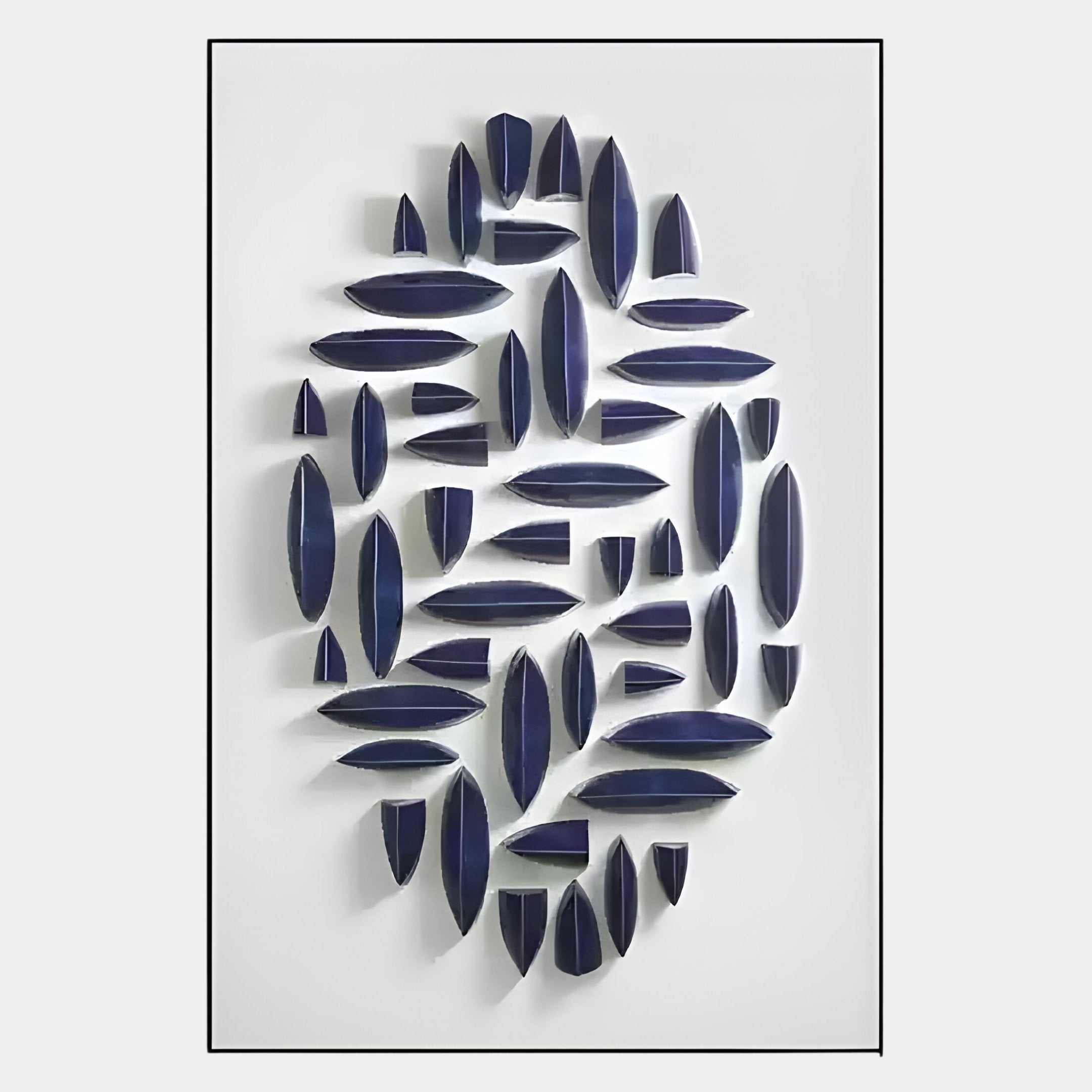 The Elysian 3D Ceramic Wall Art by Giant Sculptures showcases a modern vertical blue geometric design, featuring elongated oval and triangular pieces arranged in an abstract oval pattern on a white background.