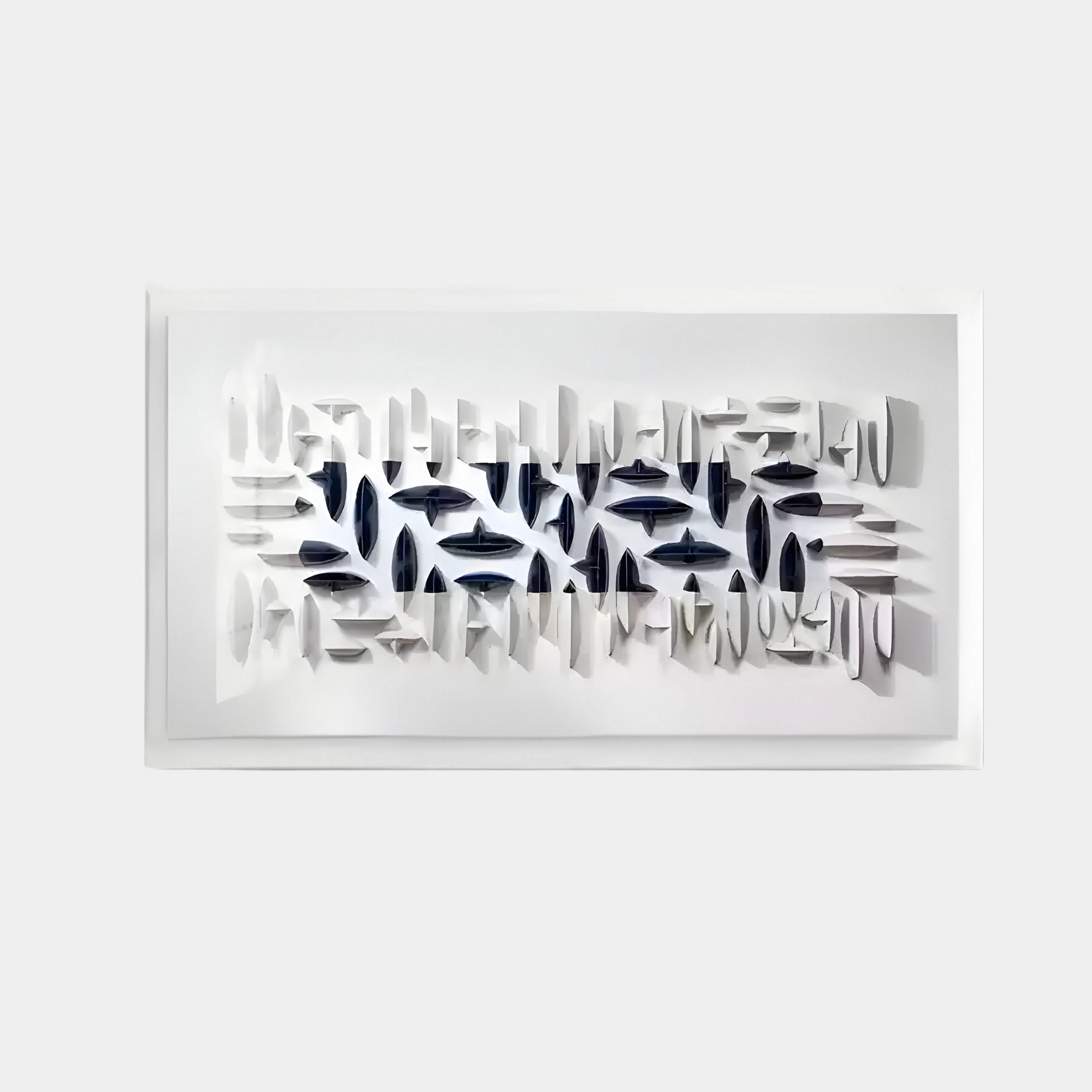 Ideal for contemporary interiors, the Elysian 3D Ceramic Wall Art by Giant Sculptures features numerous small, abstract shapes in shades of white and navy blue set in a grid pattern. This modern design is framed with a white border against a plain background.