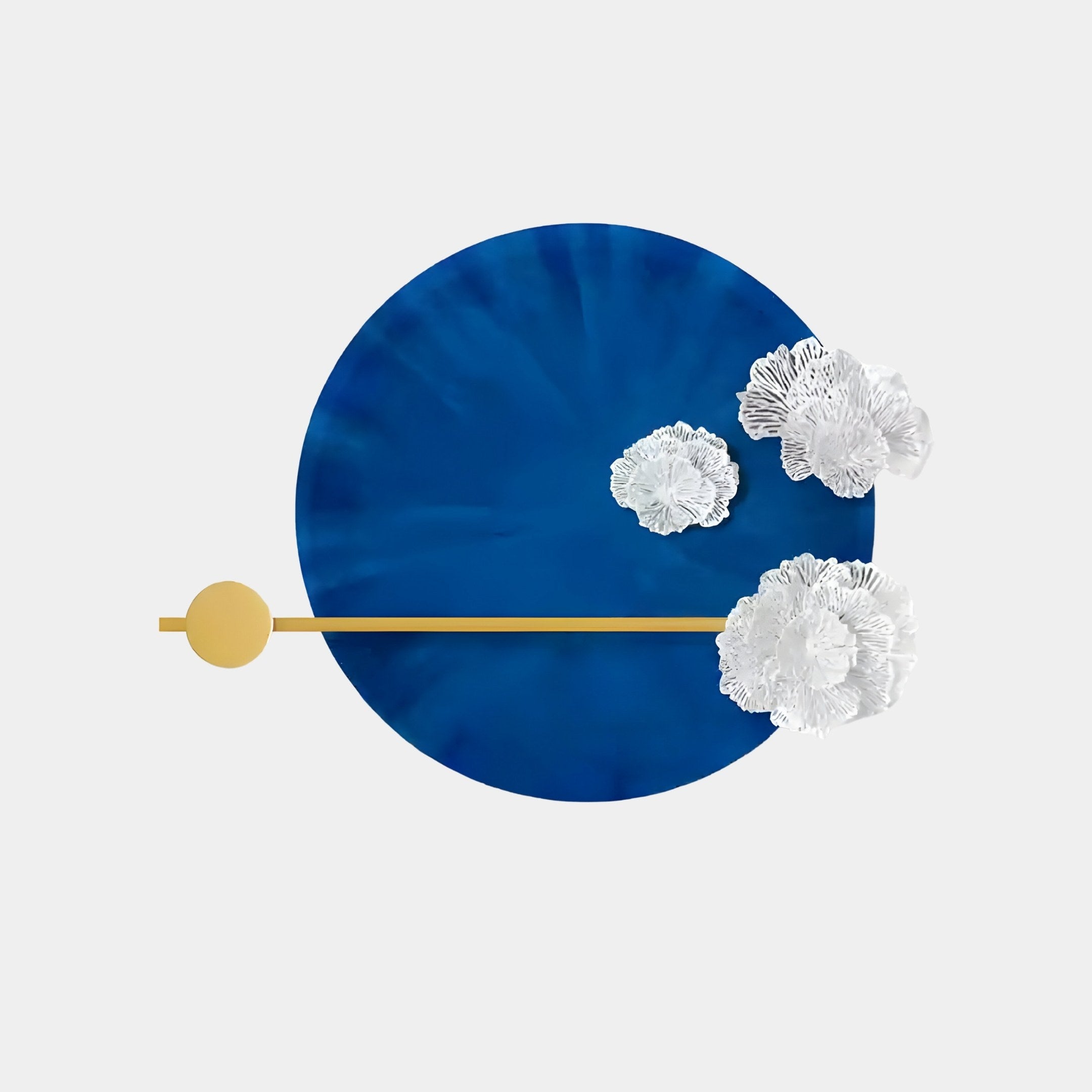 Nova Floral Radiant Sapphire Blue Circular Wall Art by Giant Sculptures features a bold blue circle with textured surfaces, white floral accents on the right, and a thin horizontal yellow line through it with a yellow circle on the left, set against a light background—ideal for modern interiors.