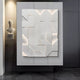 In a sleek, dark space, the Prisma White Geometric Panel 3D Wall Art by Giant Sculptures displays overlapping angular white panels in an abstract pattern. To the left, a vertical-grooved statue on a tall pedestal complements the minimalist interior decor.