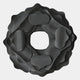The Sculptura Mirror Charcoal Grey Floral Round Metal Wall Art by Giant Sculptures features overlapping dark gray, rounded forms in a flower-like pattern with a hollow center, set against a light background.
