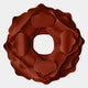 The Sculptura Mirror Terracotta Red Floral Round Metal Wall Art by Giant Sculptures features a geometric floral design with overlapping smooth-edged layers and a center hole, ideal as modern wall decor on a plain white background.