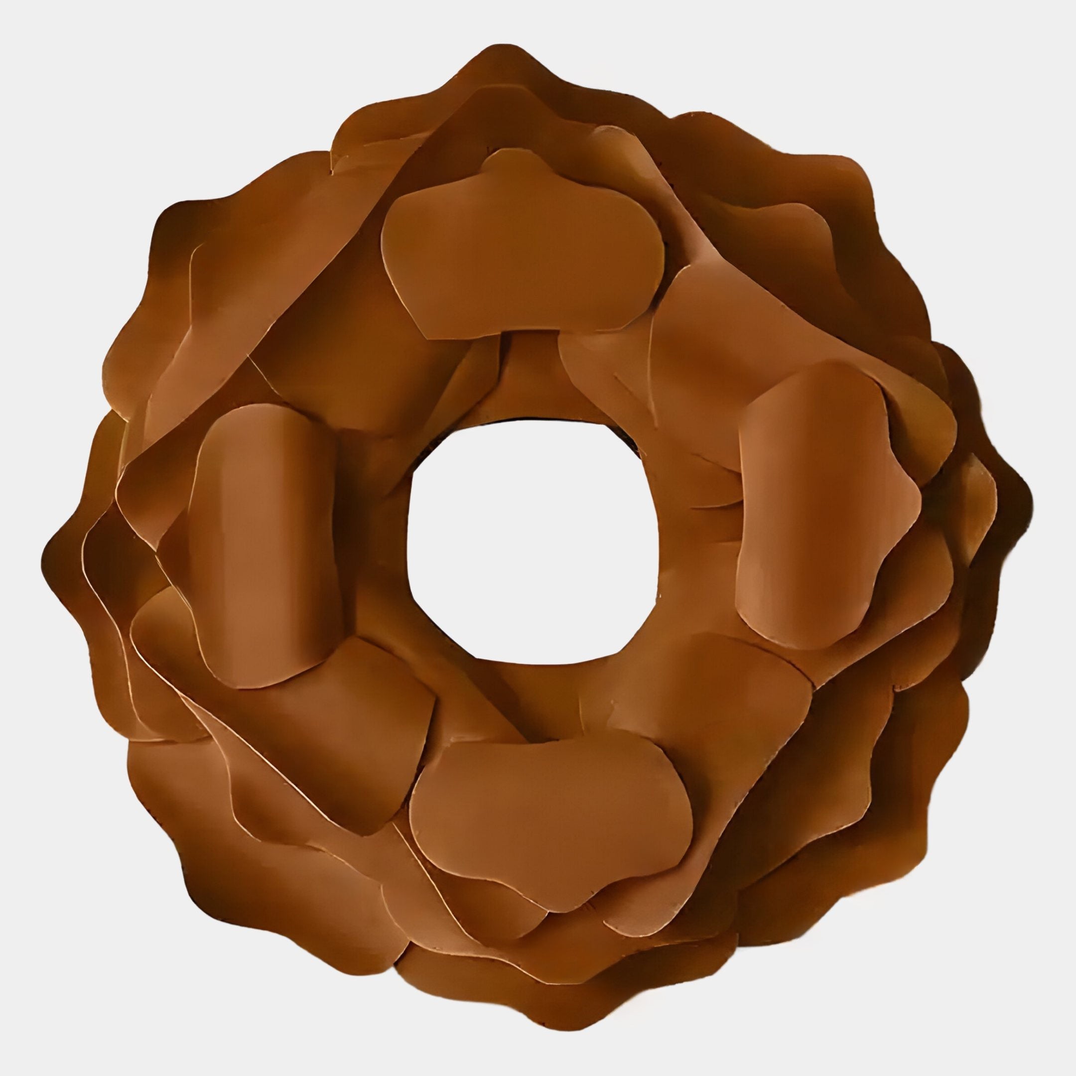 The Sculptura Mirror Warm Brown Floral Round Metal Wall Art by Giant Sculptures features layered, petal-like segments and a central hole, displayed from above on a plain white background.