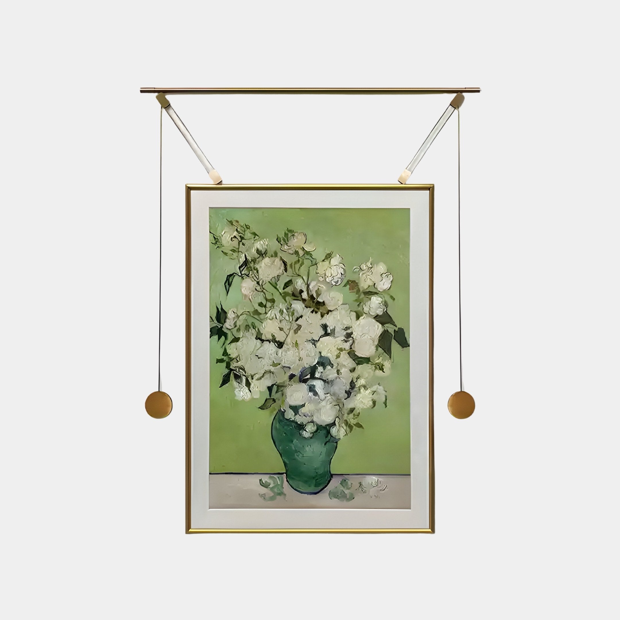 The Reverra White Blossoms Hanging Frame Wall Art by Giant Sculptures displays a lush bouquet of white flowers in a green vase on a light green background. It’s elegantly showcased with an overhead light fixture featuring two suspended cords with gold accents.