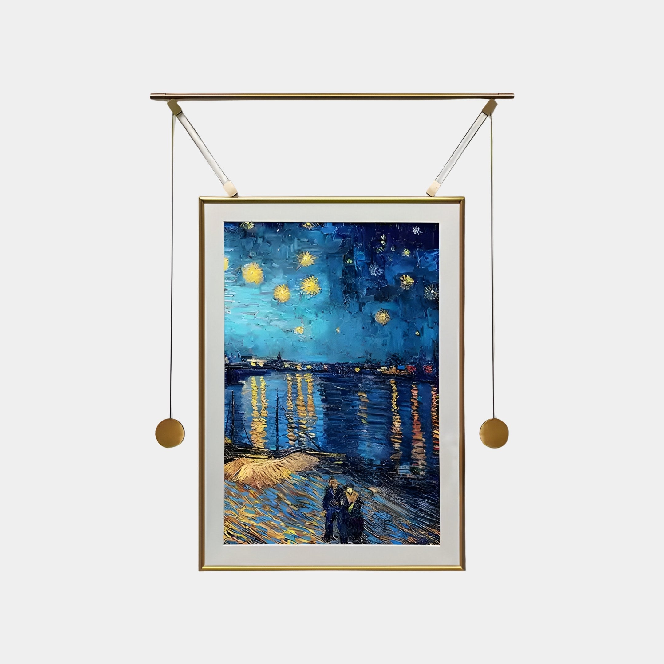 The Reverra Starry Night Over The Rhone Hanging Frame Wall Art by Giant Sculptures shows a starry sky over a river with light reflections, featuring two figures at the shore. Its gold frame makes an artistic statement, and the visible hanging mechanism includes two cords with weights.