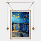 The Reverra Starry Night Over The Rhone Hanging Frame Wall Art by Giant Sculptures features a starry sky over the river, displayed in a modern gold frame suspended by weighted cords—an eye-catching artistic statement for any room.