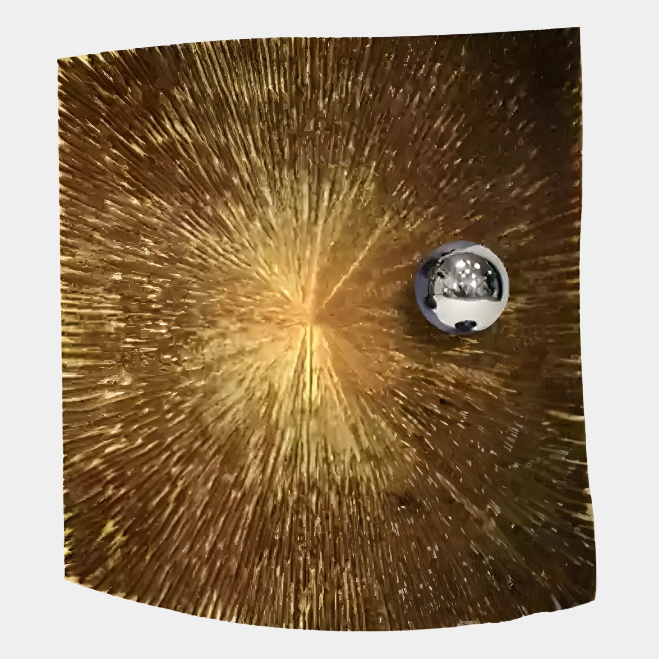 The Astralis Golden Nova Abstract 3D Wall Art by Giant Sculptures features a metallic sphere on a golden, textured panel radiating dynamic starburst streaks, creating striking abstract flair and reflecting its surroundings in modern interiors.