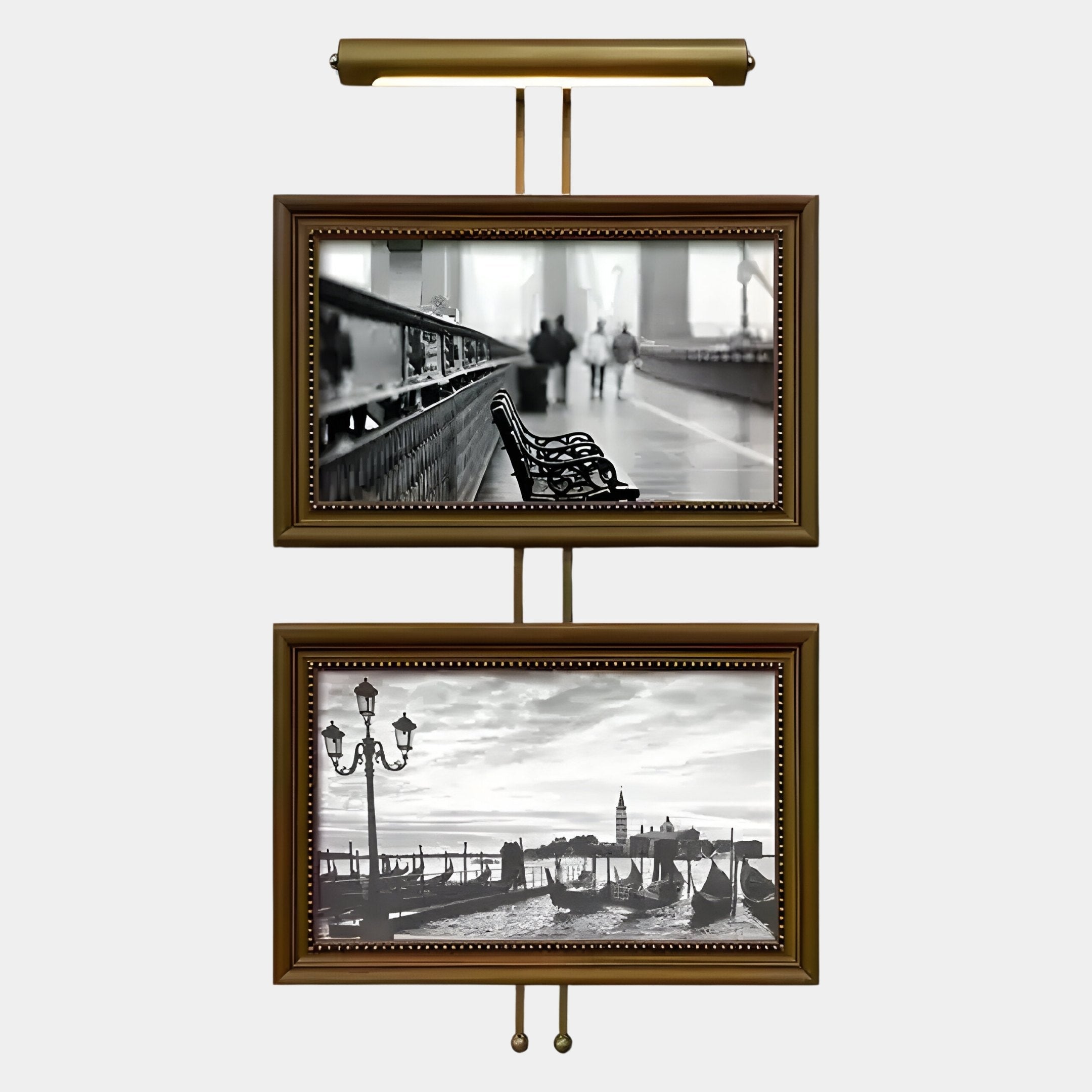 Two framed black-and-white prints from Giant Sculptures’ Artisera Venetian Promenade Classic Dual Frame Built-In Light Wall Art hang vertically, featuring blurred figures on a bridge above gondolas and lampposts in elegant Venetian style.