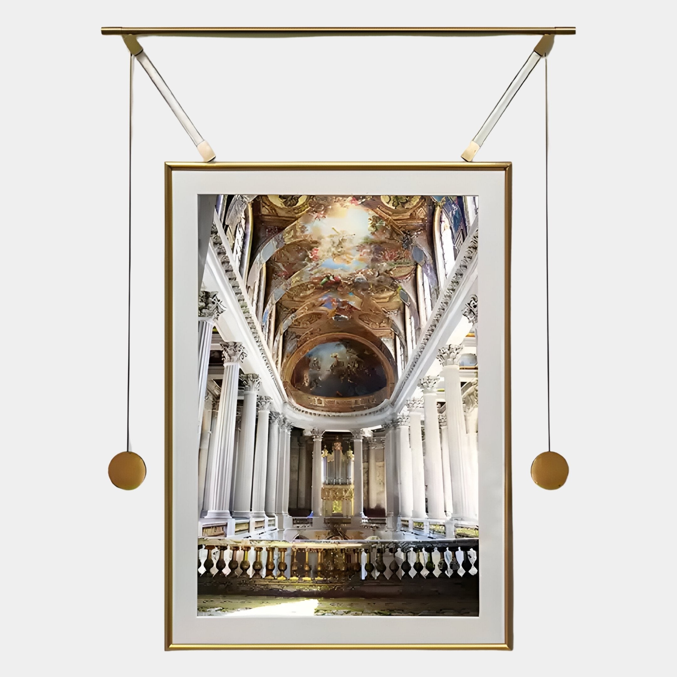 The Aristo Grand Cathedral Painting Gold Frame Hanging Wall Art by Giant Sculptures displays architectural grandeur with white columns, a vivid ceiling, and gold accents, elegantly suspended by a modern system with gold weights and rods.