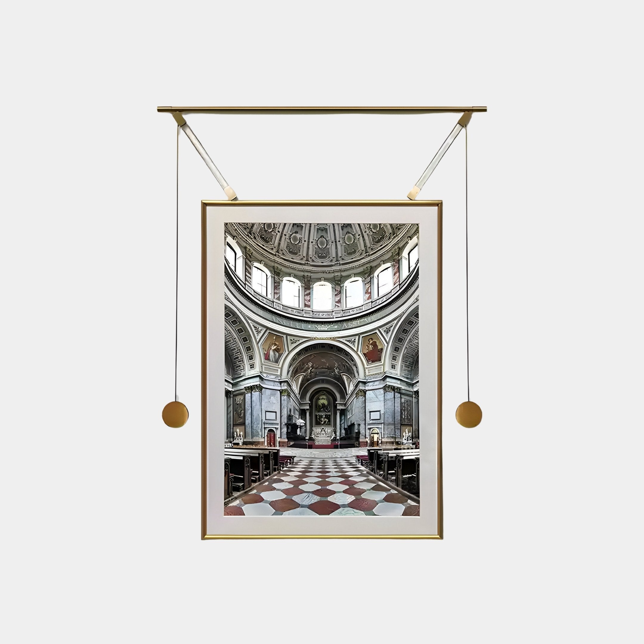 The Aristo Dome Elegance Painting Gold Frame Hanging Wall Art by Giant Sculptures depicts a stunning cathedral interior with arched ceilings and decorative columns, elegantly hung by a gold mechanism. The checkered flooring enhances the overall effect of dome elegance.