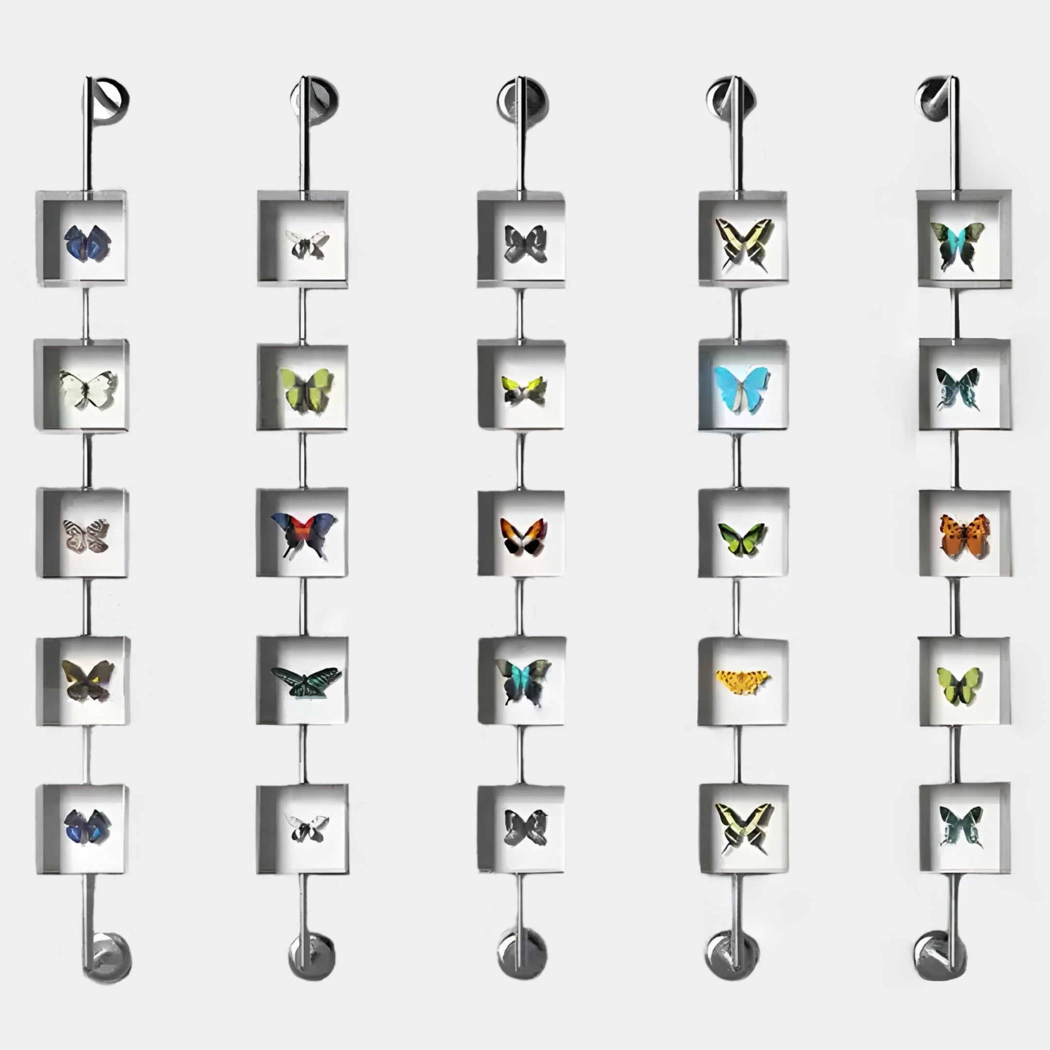 The Papilio Butterfly Cascade Clear Modern 3D Wall Art Set by Giant Sculptures features five vertical rows of square frames with vibrant butterfly illustrations, linked by rods for a stunning modern effect against a white background.