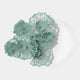 The Fleur Halo White Round Green Metal Floral Decorative Wall Art by Giant Sculptures features intricate, layered teal and green floral designs, artistically arranged for a striking nature-inspired effect.
