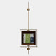 The Ethereal Frames Abstract Green Vintage Suspended Wall Art by Giant Sculptures features abstract art in a brown frame, suspended in a gold geometric metal structure with rectangular accents against a plain white background.