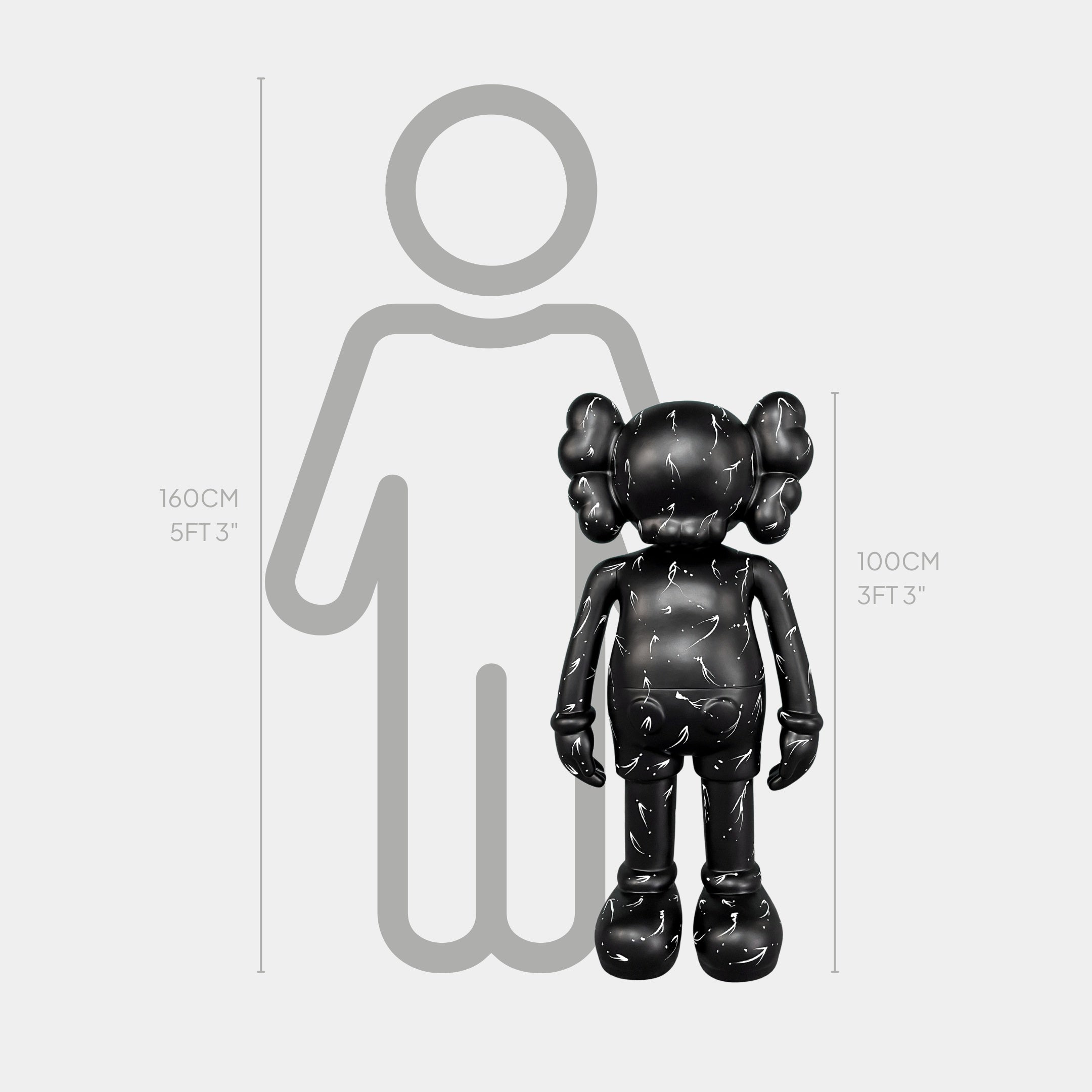 A black cartoon-like figure, the Black Stone Iconify Standing Sculpture - 100cm by Giant Sculptures, stands before a gray outline of a person measuring 160 cm (5 ft 3 in).
