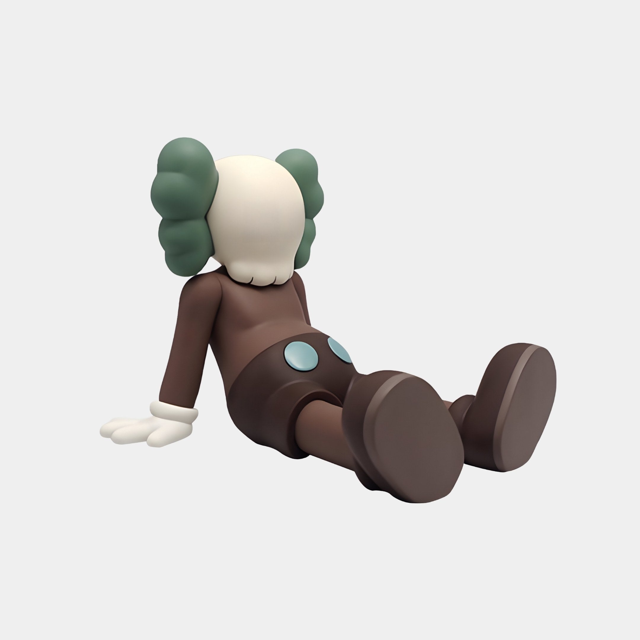 A cartoon figure, echoing the Hazelnut Brown Iconify Daydream Sculpture by Giant Sculptures, has green earmuff-like hair. Reclining with its left hand down, it displays an off-white face, brown body, and large shoes. Crafted from premium resin, it perfectly blends contemporary artistry.