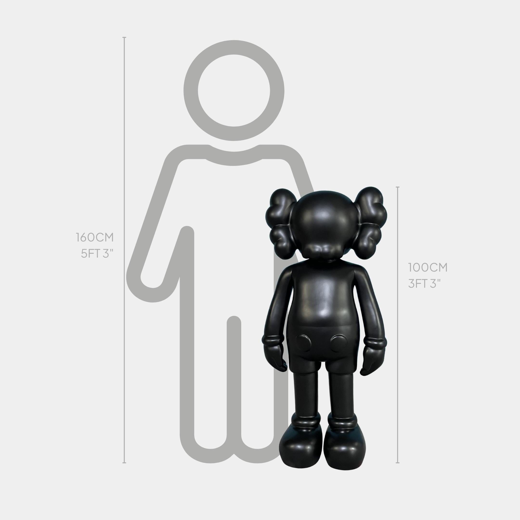 Midnight Black Iconify Standing Sculpture by Giant Sculptures shown at 100cm beside a 160cm human silhouette scale graphic on a plain light grey background.