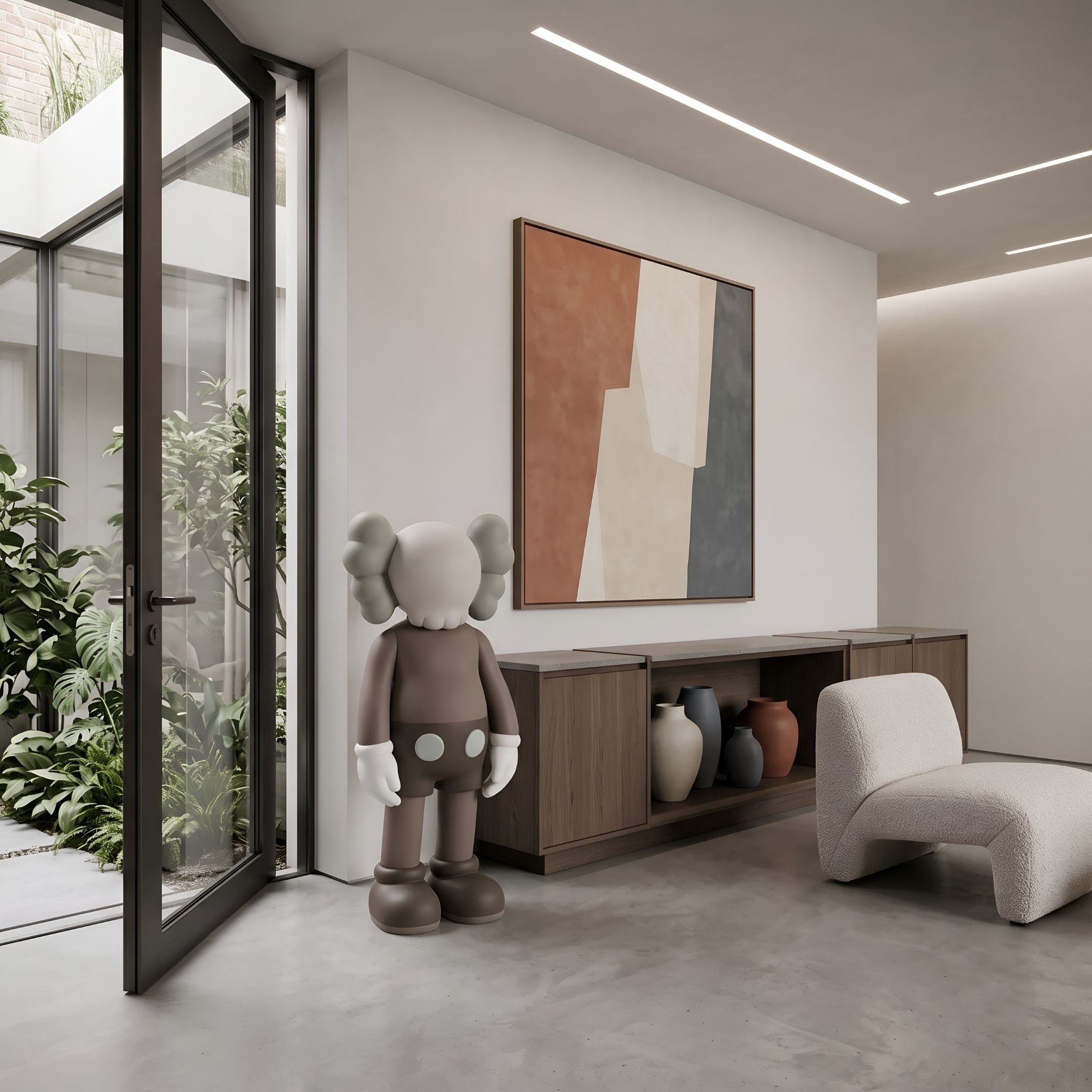 Hazelnut Brown Iconify Standing Sculpture, 100cm, resin figure with round head and pale gloved hands, displayed beside a console and abstract wall art in a living room.