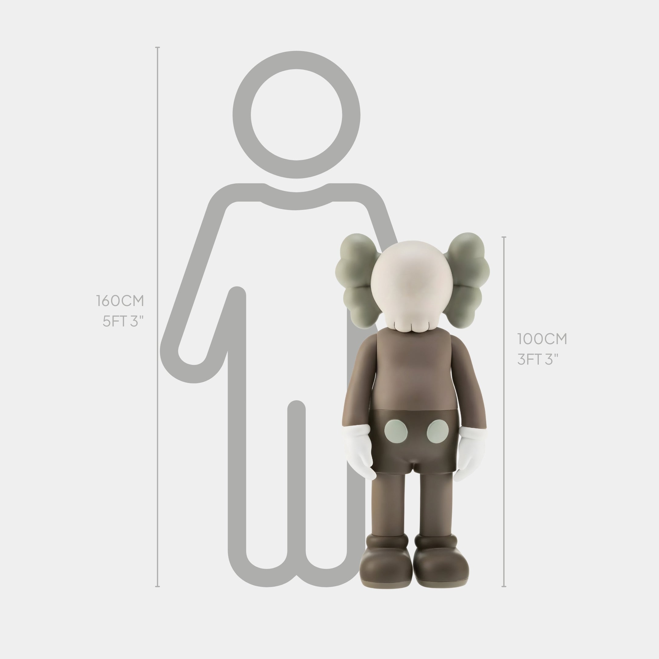 A Hazelnut Brown Iconify Standing Sculpture - 100 cm by Giant Sculptures stands next to a gray outline of a person. With its round head, X-shaped eyes, and large gloved hands, it exudes contemporary elegance and resembles a cartoon character while showcasing artistic expression.