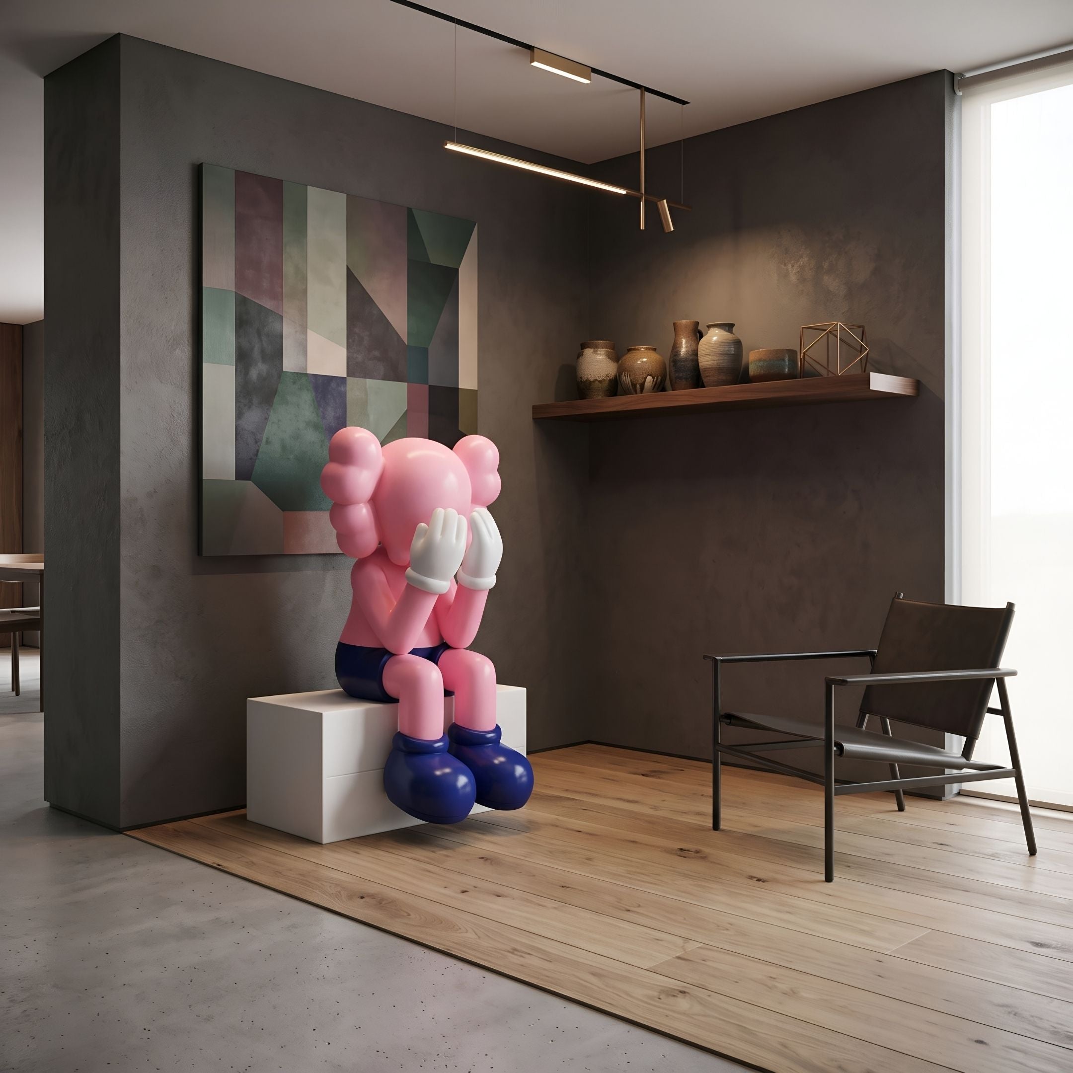 Petal Pink Iconify Melancholy Sitting Sculpture, 110cm, seated with hands over face on a white plinth, in a modern room with dark walls and abstract art.