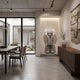 Soft Grey Suit Iconify Director Sculpture, 130cm, standing figure in tailored grey suit finish on a wall-mounted alcove plinth beside a dining area and wooden sideboard.