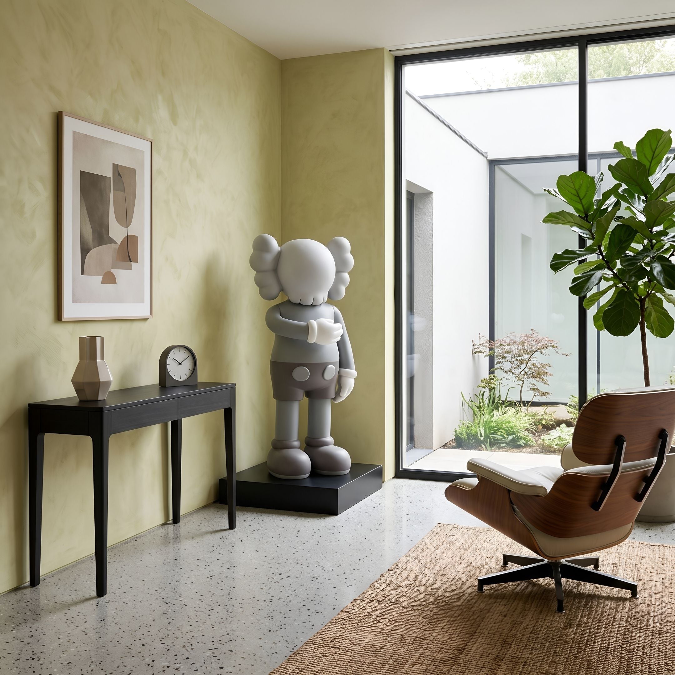 Soft Grey Iconify I Dance Sculpture, 130cm, on a black plinth in a living room corner with a console table, framed art, and Eames-style lounge chair nearby.