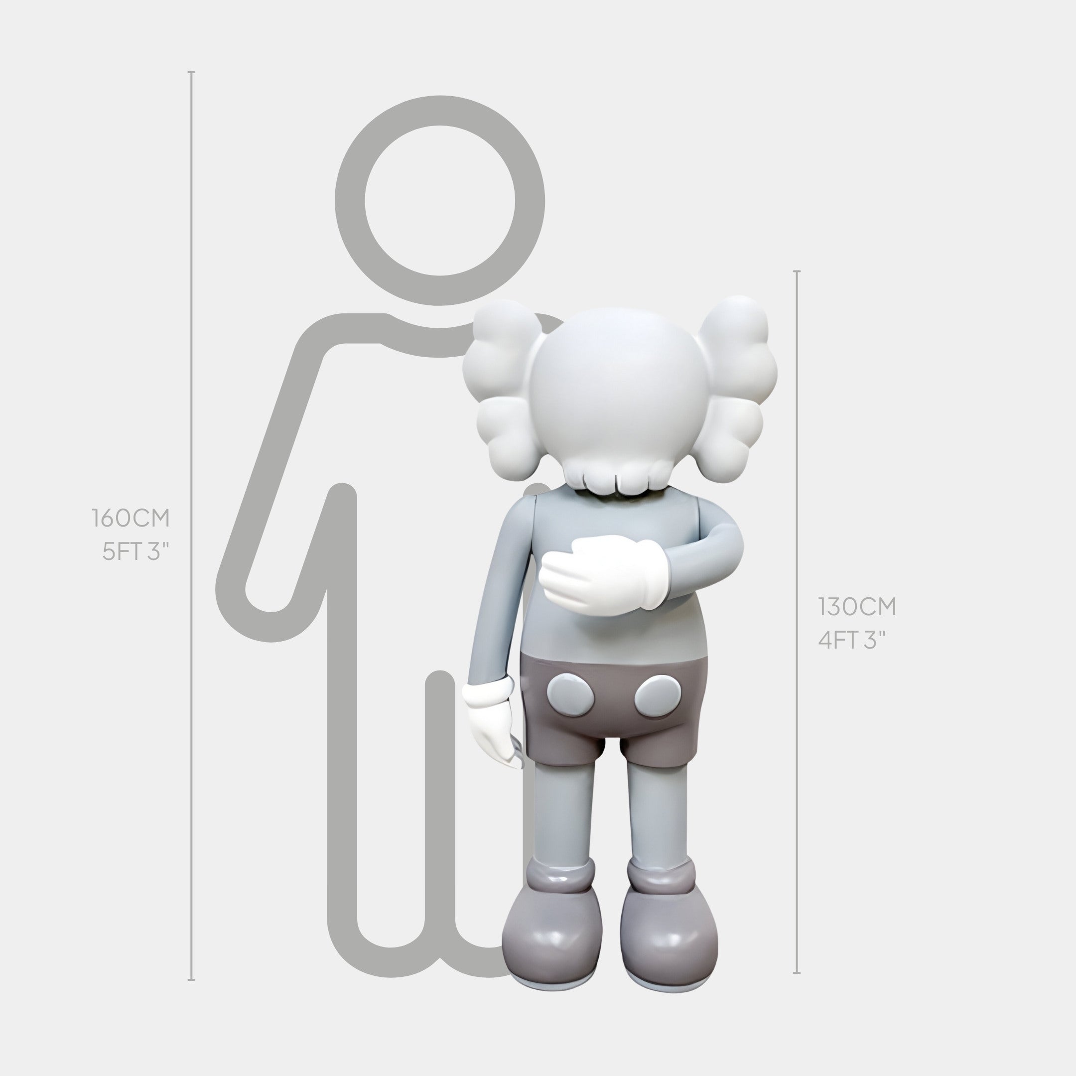 Designed by Giant Sculptures, the Soft Grey Iconify II Dance Sculpture features a cartoon figure with gloved hands and crossed bones for ears. It stands at 130 cm (4 ft 3 in) next to a 160 cm (5 ft 3 in) adult silhouette, offering a playful, modern twist.