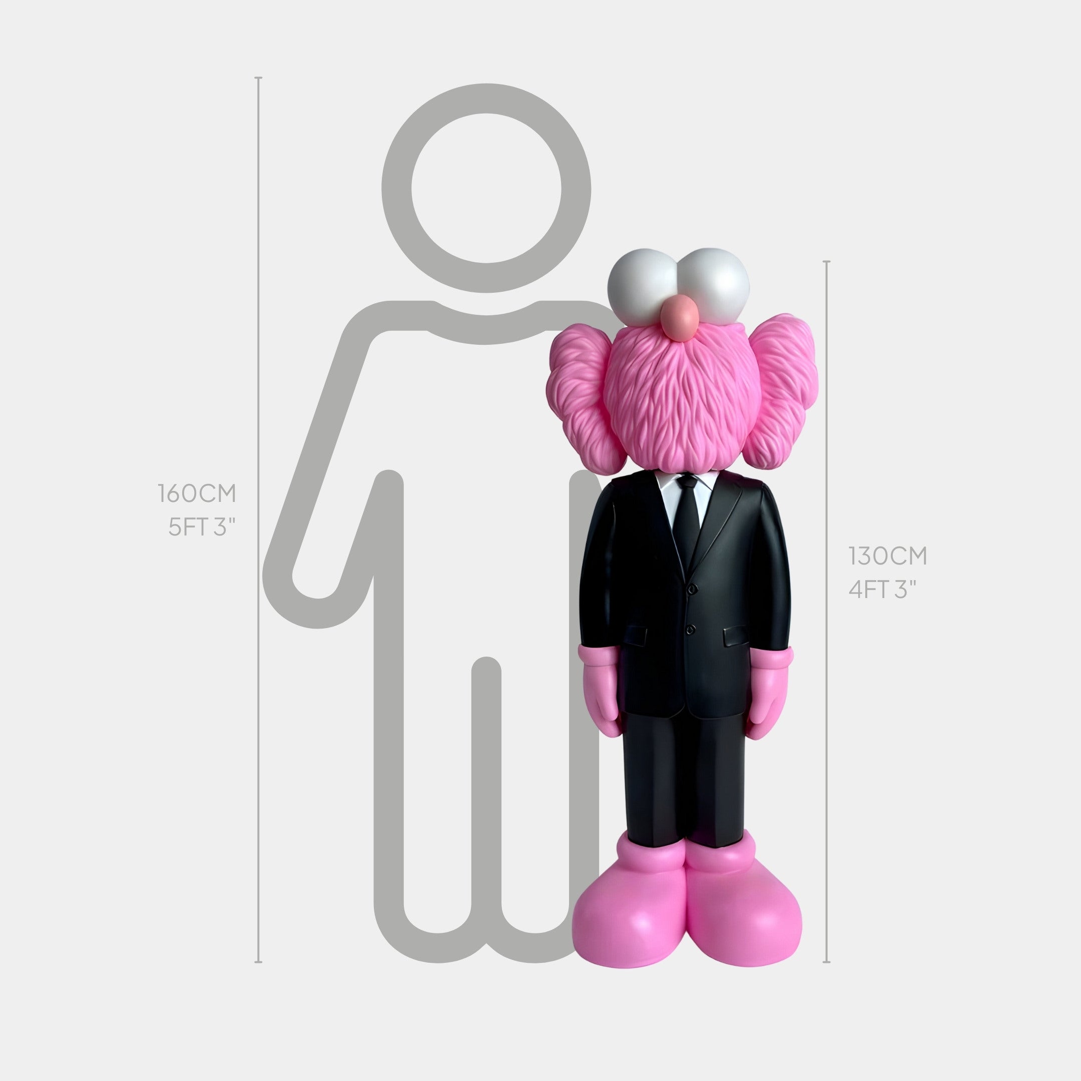 The Black Suit Iconify CEO Sculpture by Giant Sculptures, a pink furry character in a black suit and tie, stands beside a simplified 160 cm human silhouette with height markers. This modern luxury piece measures 130 cm (4 ft 3 in).